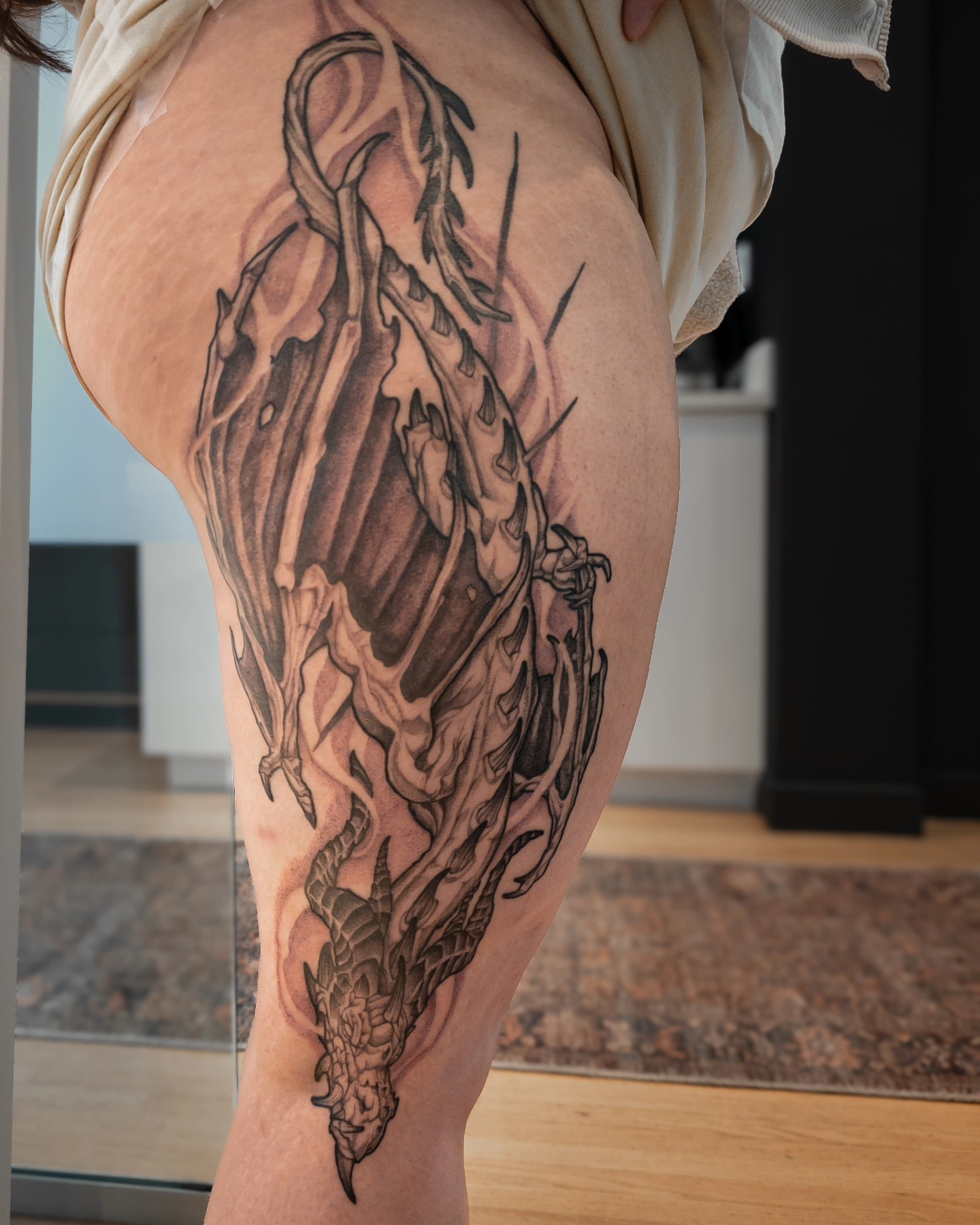 Dragon realism tattoo on the thigh by EyeSee Tattoos