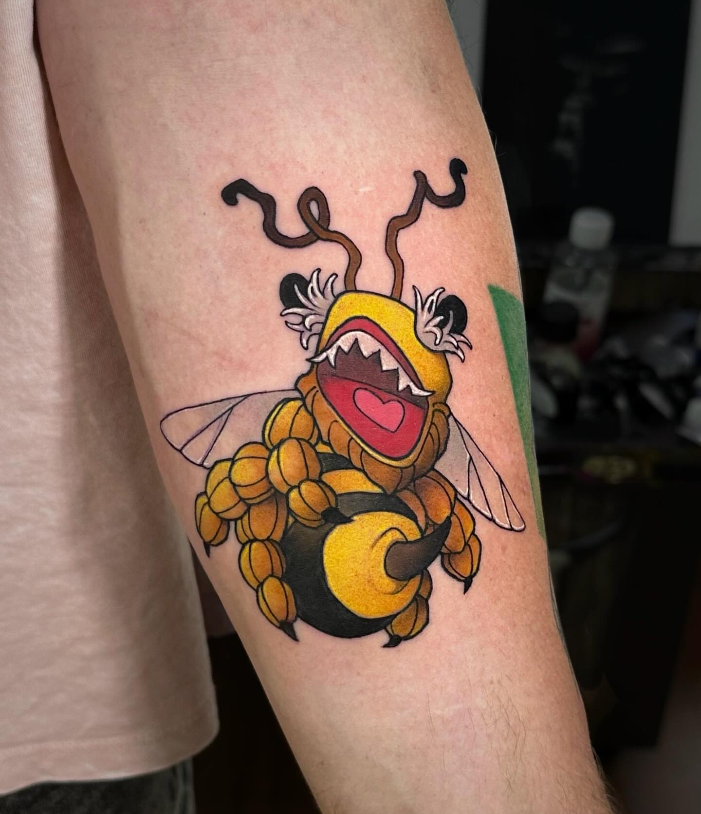 Bee American traditional tattoo on the forearm by Lena Aleksandrova
