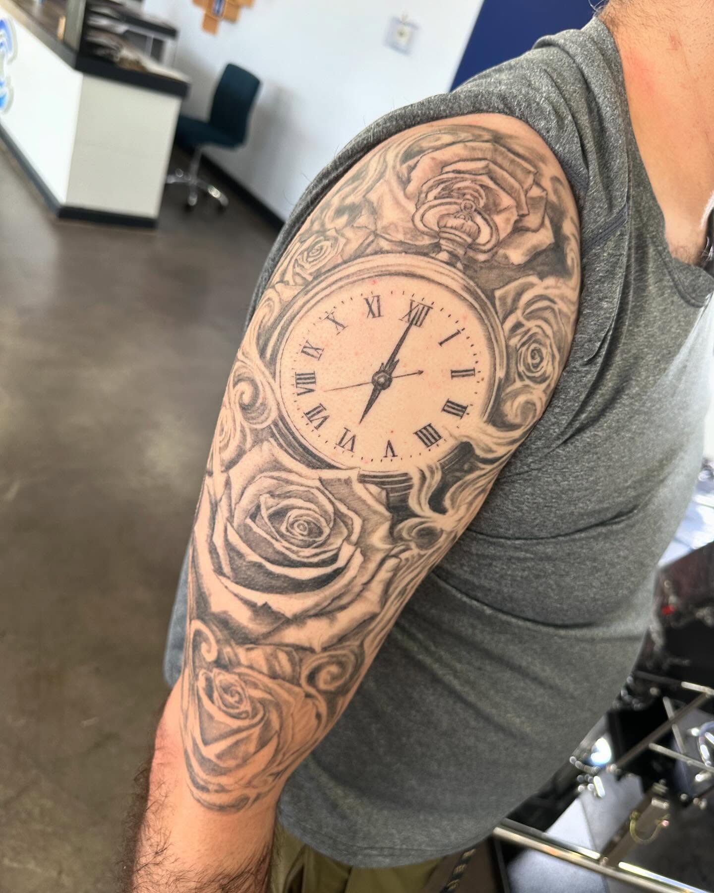 Clock and roses realism tattoo on the forearm by Cameron Hobbs, Woodbridge, Virginia
