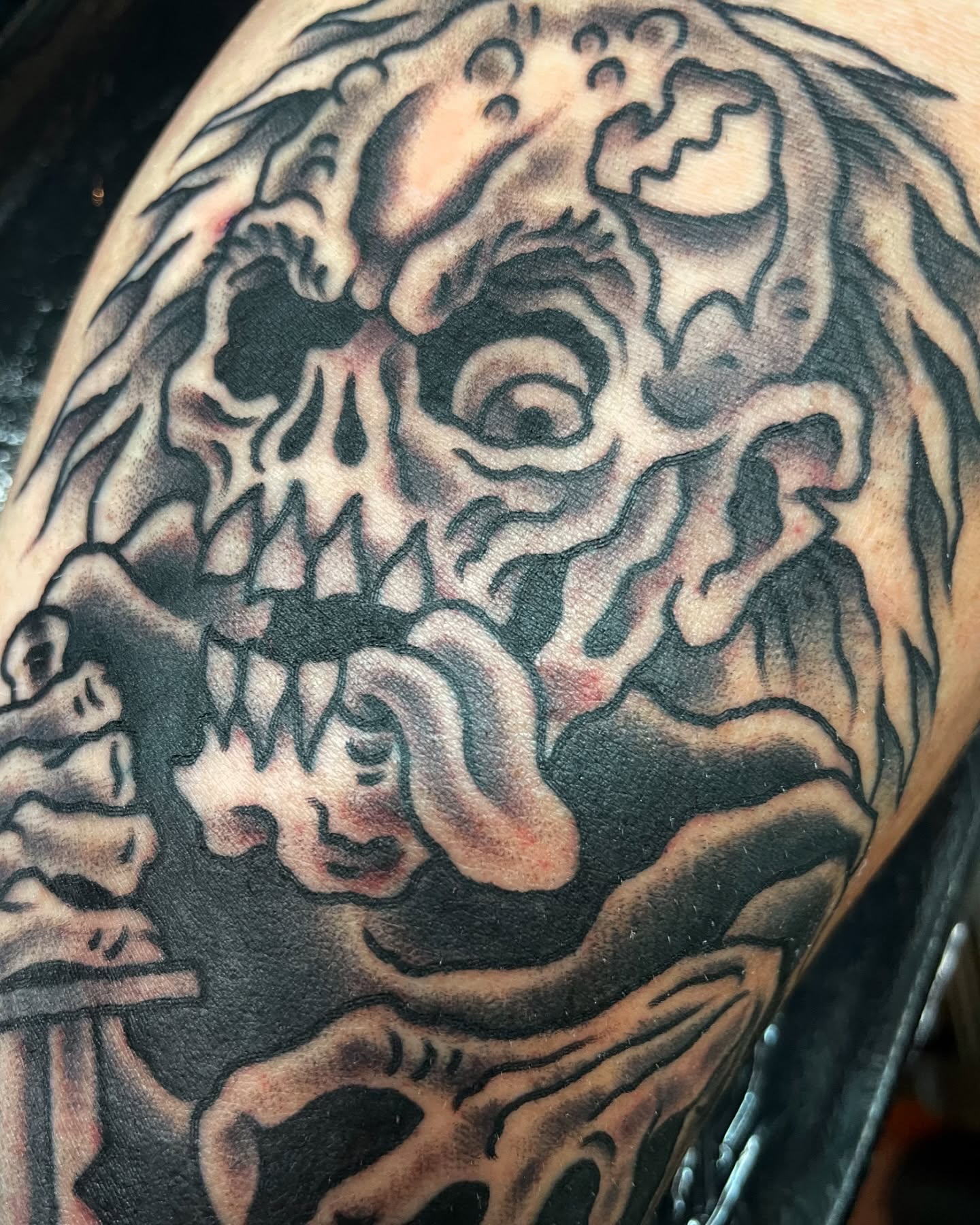 Skull black and grey tattoo on the shoulder by Tom Taylor, Philadelphia, Pennsylvania