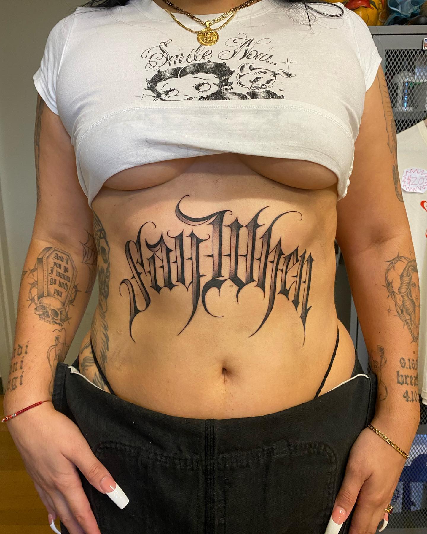 Gothic script tattoo on the torso by Alan Pham, San Jose, California