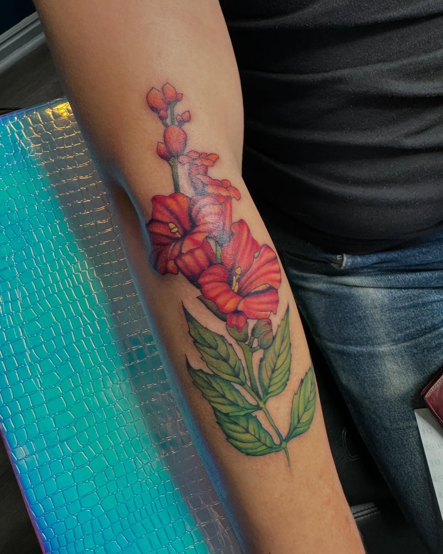 Flowers realism tattoo on the forearm by Robyn Mahon