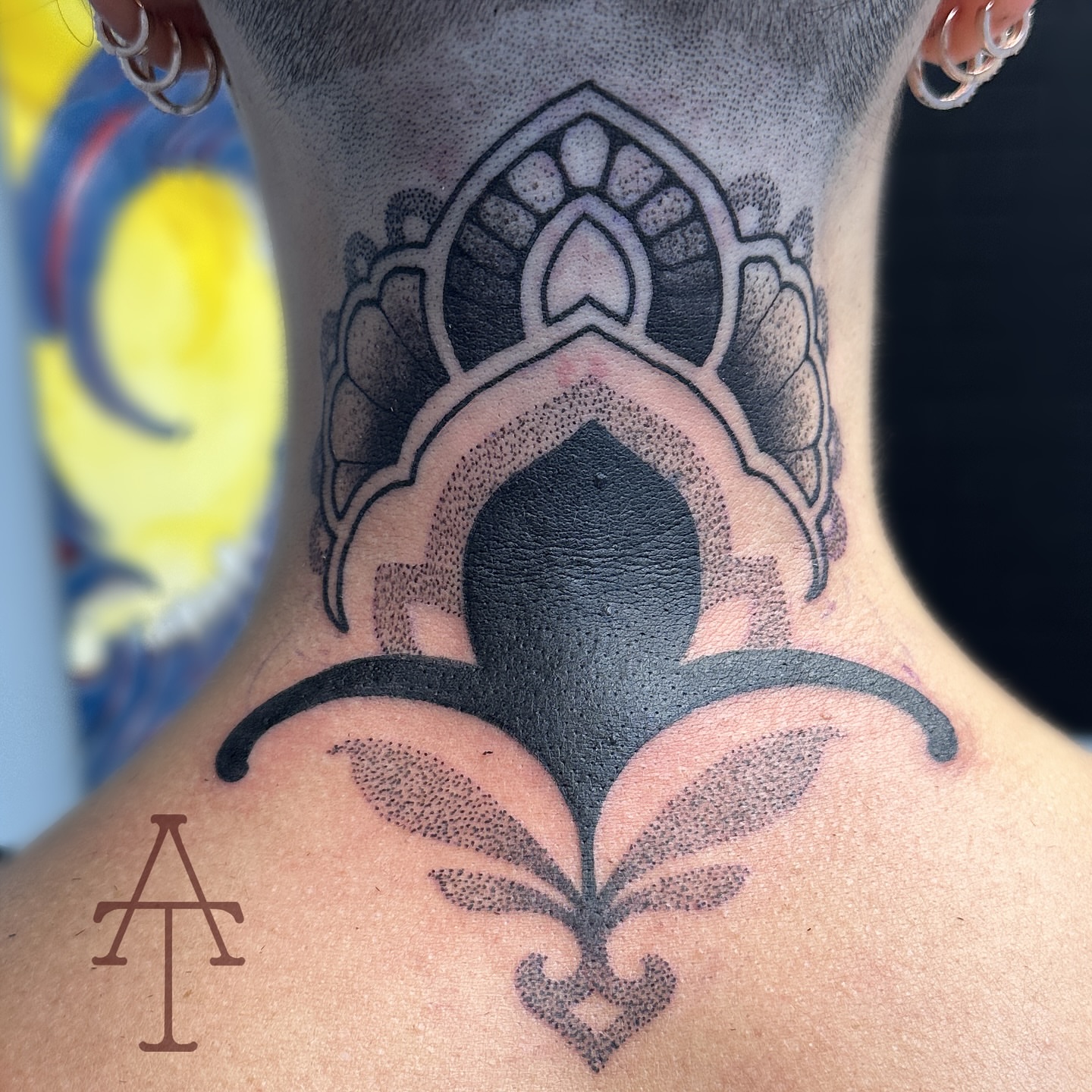 Fleur-de-lis dotwork tattoo on the neck by Chris Dobransky