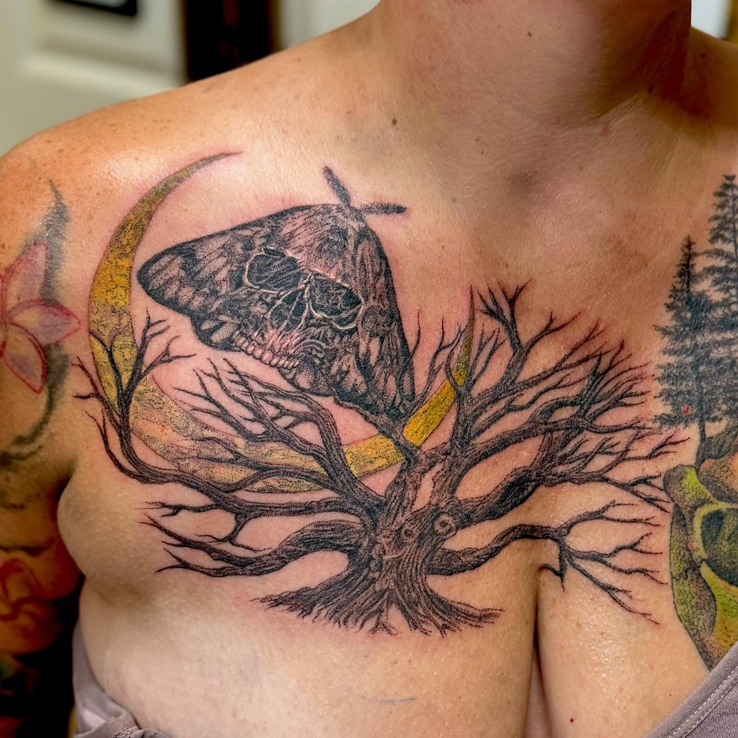 Tree with skull and moth realism tattoo on the chest by William Worley