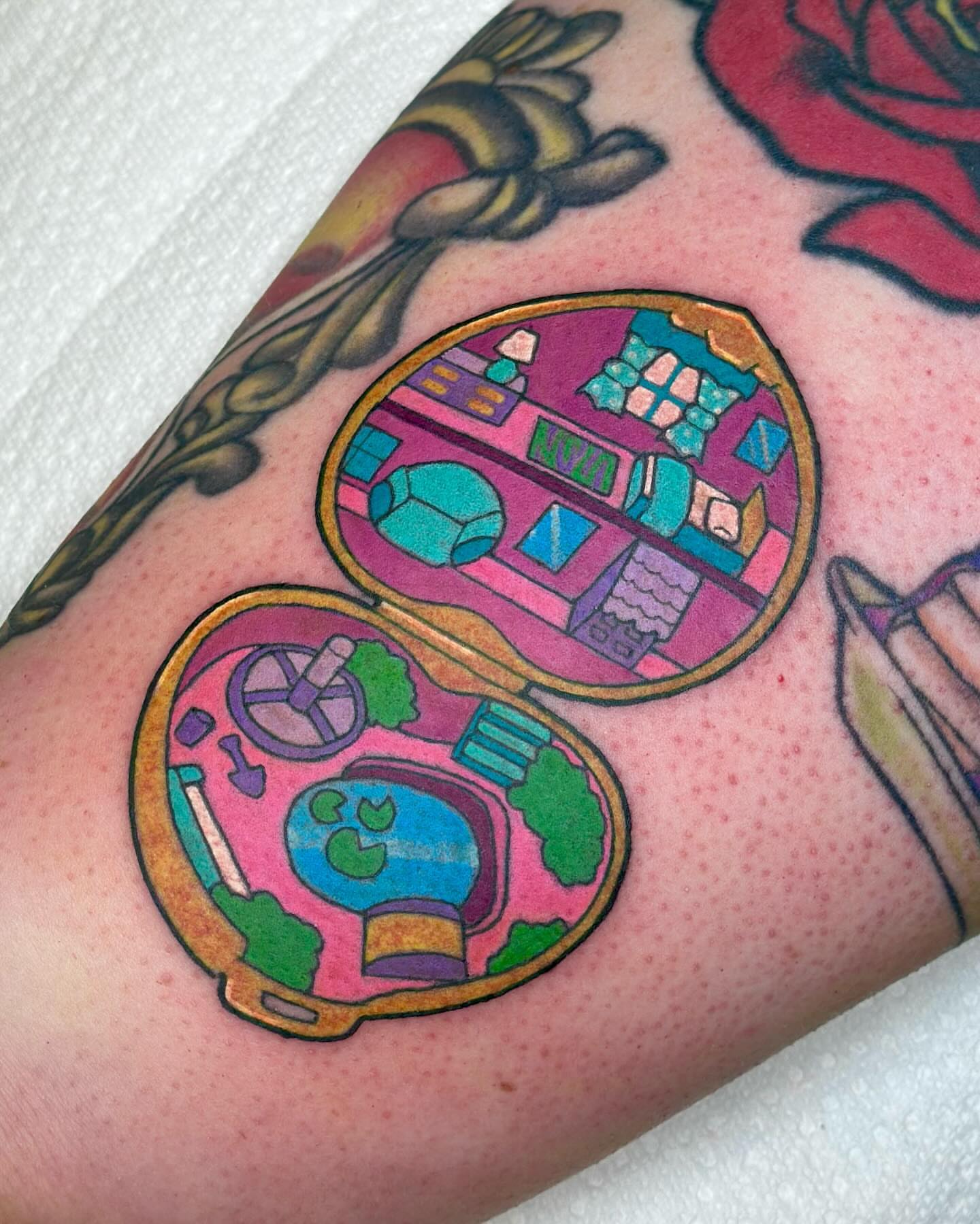Space-themed room new school tattoo on the forearm by Katie Kelley