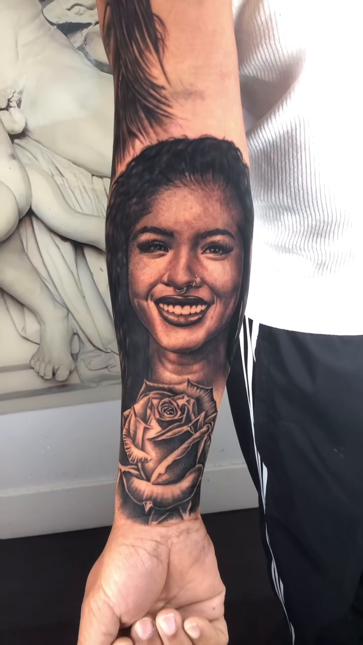 Woman and rose realism tattoo by Danny Rodriguez