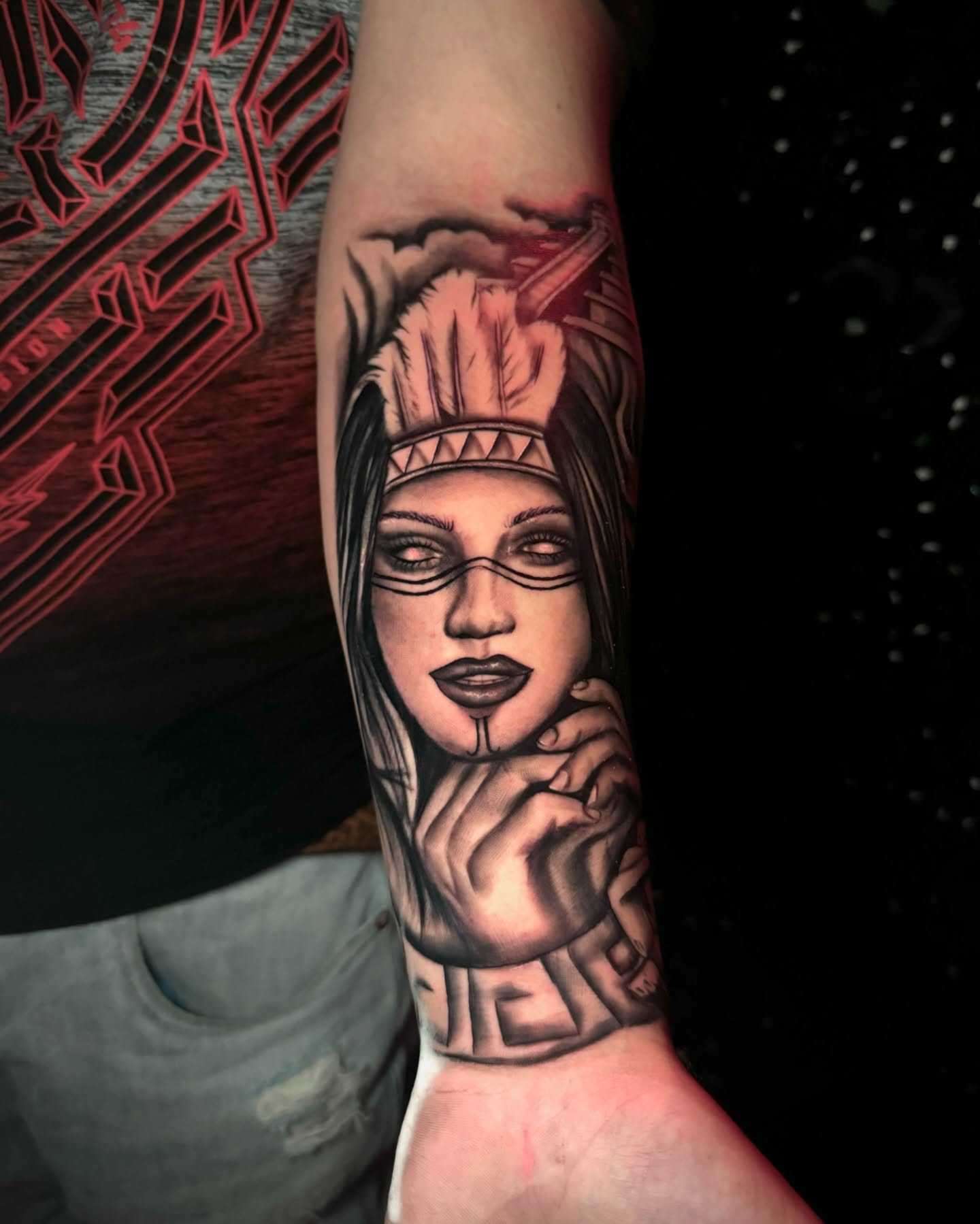 Woman with headdress realism tattoo on the forearm by Tattoo Artist