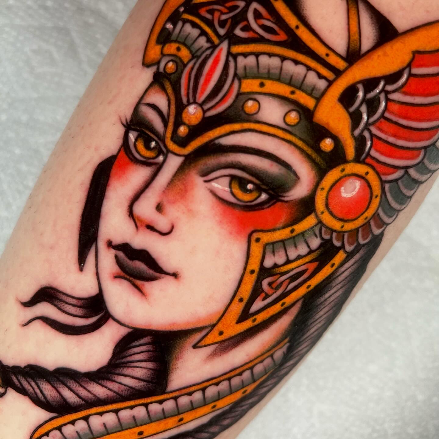 Woman with helmet American traditional tattoo on the forearm by Hailey Johnson