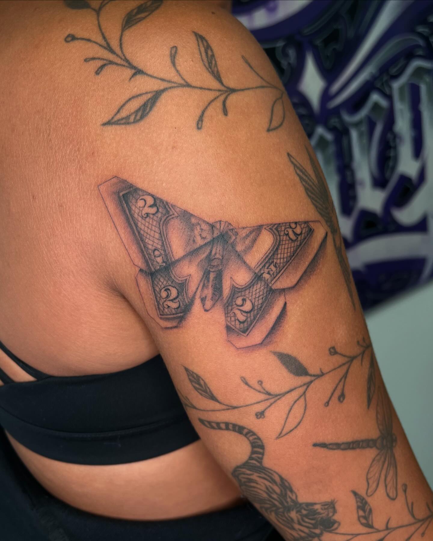 Butterfly black and grey tattoo on the shoulder by San Diego Fineline Black & Grey Tattoo Artist