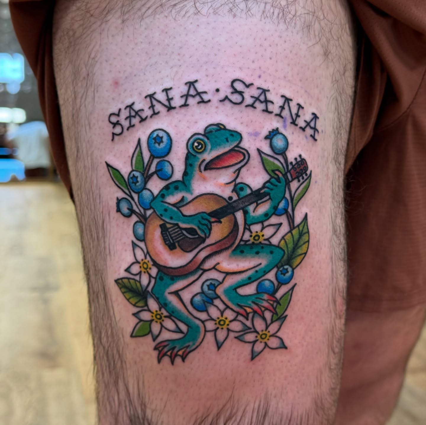 Frog playing guitar American traditional tattoo on the thigh by 𝙹𝙴𝚆𝙴𝙻𝚂 𝙸𝙳𝙴𝚃𝚃𝙴 𝙳𝙸𝚃𝚃𝚁𝙸𝙲𝙷 (𝙻𝙰𝚂𝙾𝚃𝙰), Minneapolis, Minnesota