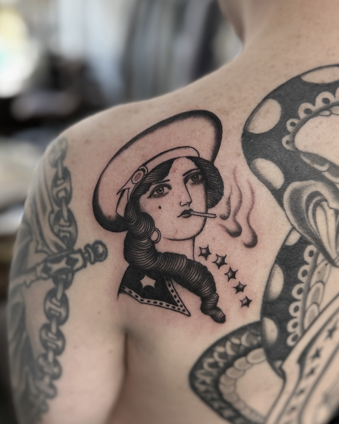 Flapper woman smoking American traditional tattoo on the shoulder by Nicholas Lee, San Francisco, California
