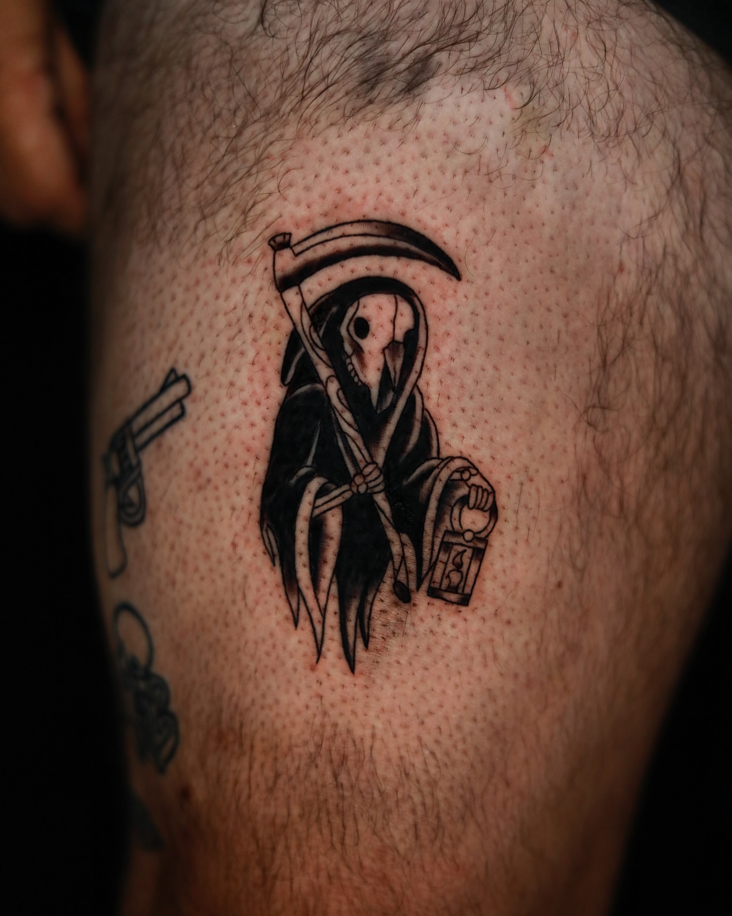 Grim reaper black and grey tattoo on the thigh by memo