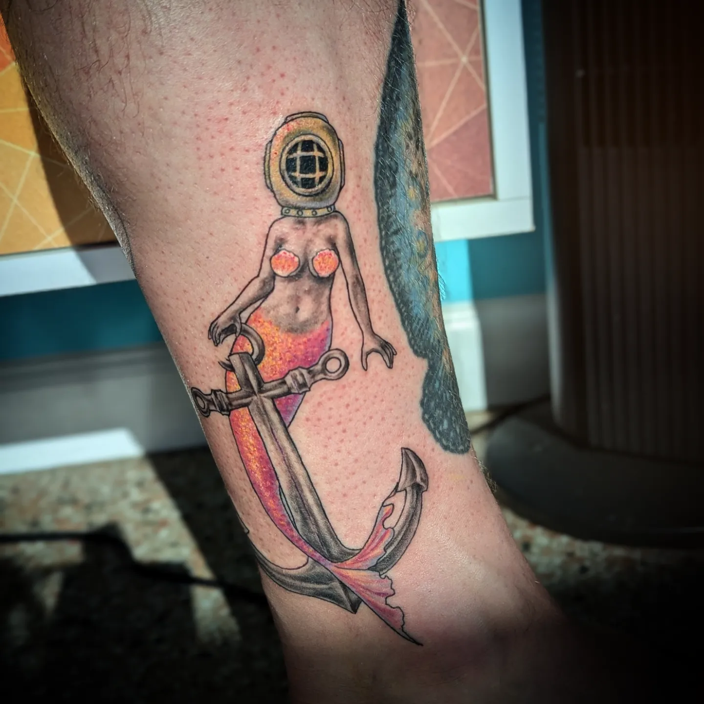 Mermaid with anchor realism tattoo on the thigh by Lorelei