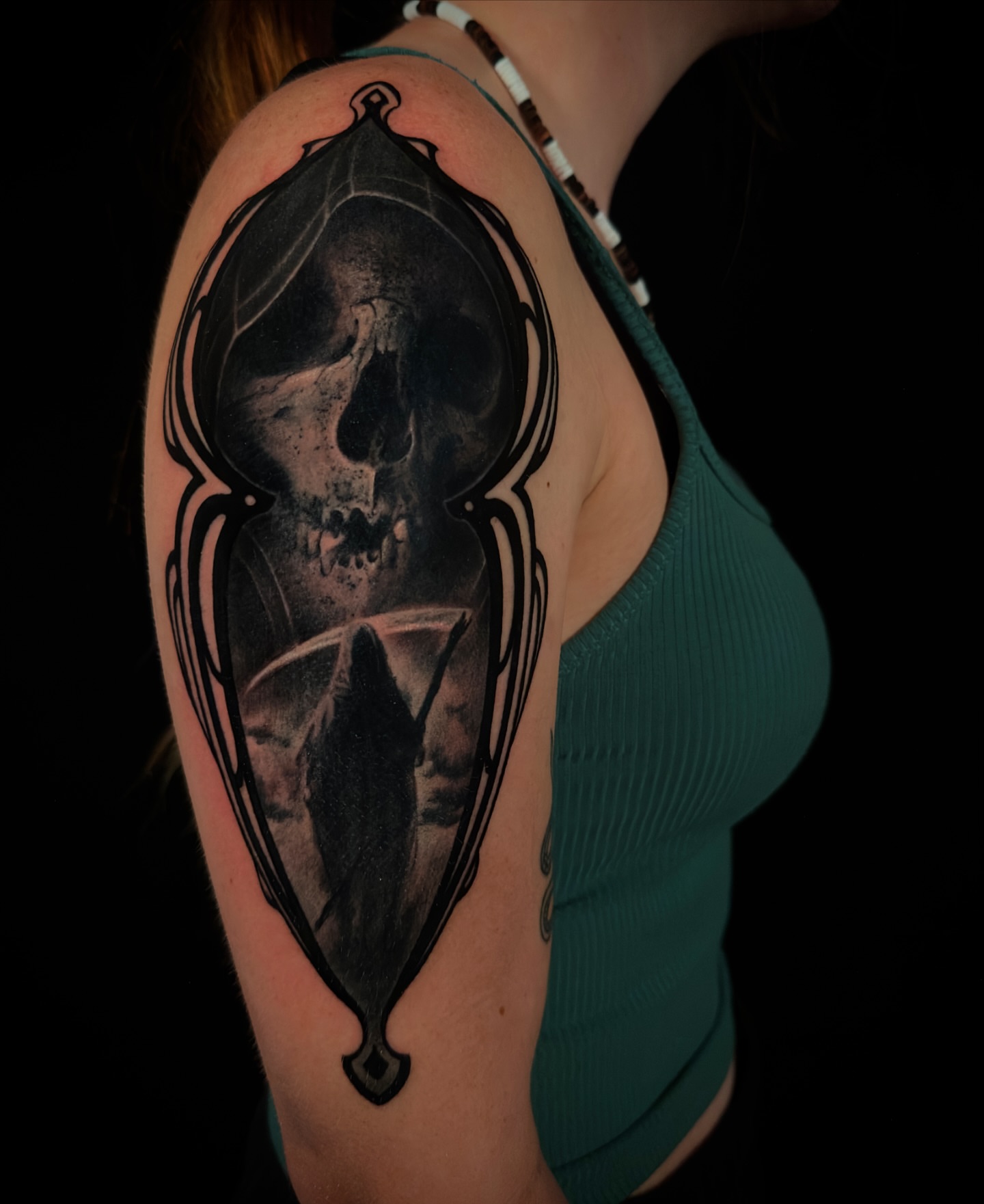 Skull realism tattoo on the shoulder by Nic Luna