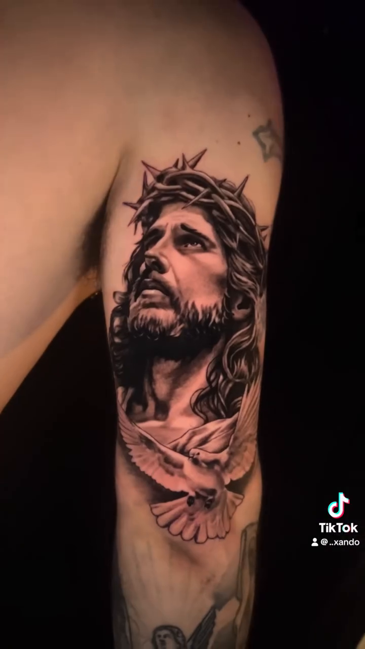 Jesus Christ and a dove realism tattoo by Xando