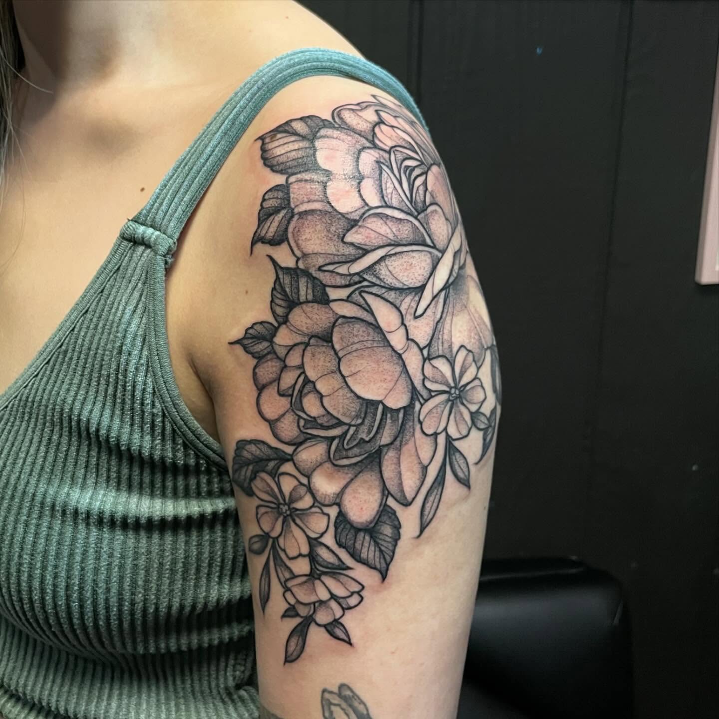 Flowers dotwork tattoo on the shoulder by JoDee Yates