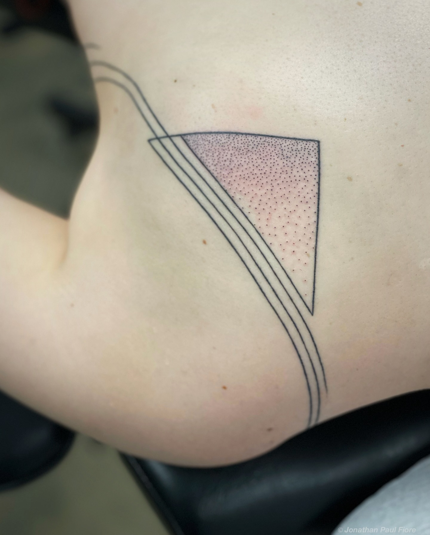 Triangle dotwork tattoo on the shoulder by Jonathan Paul Fiore, Austin, Texas