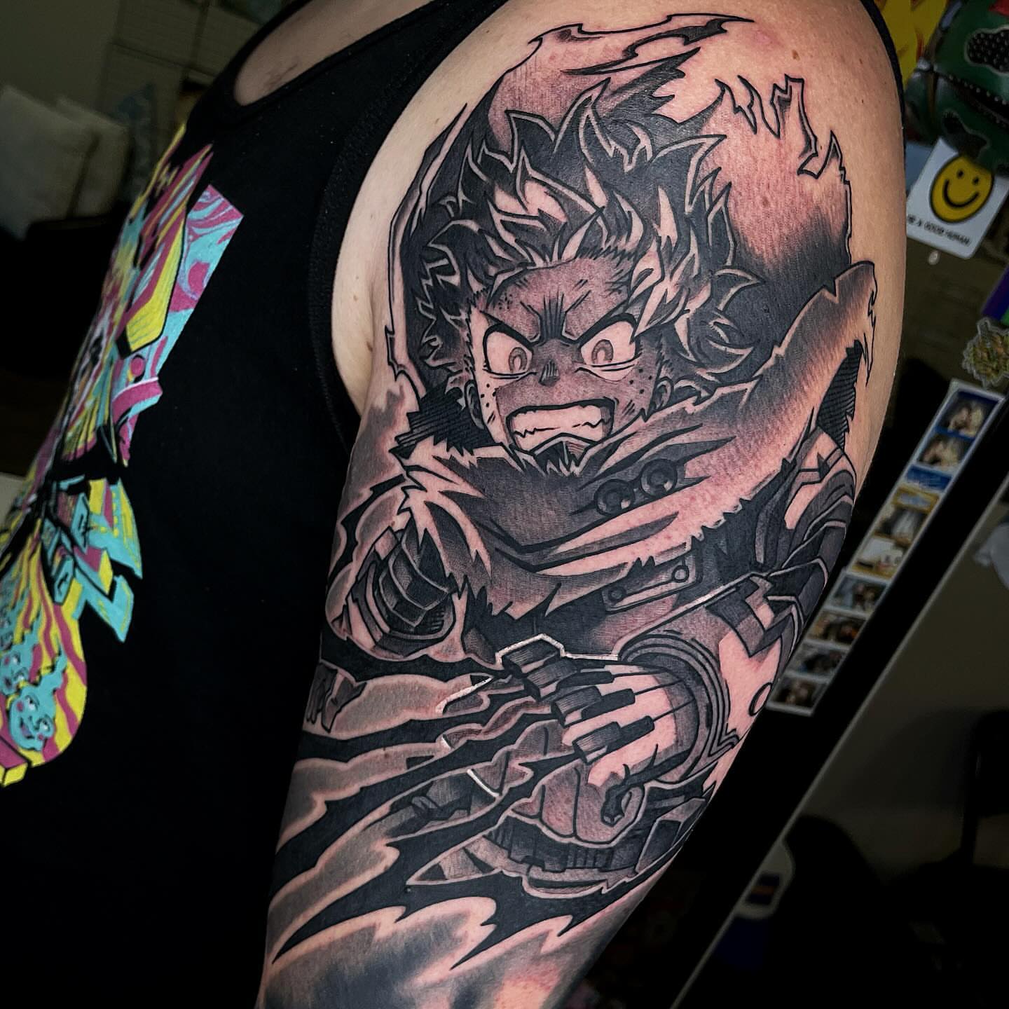 Anime character anime tattoo on the upper arm by Bold Anime Tattoos