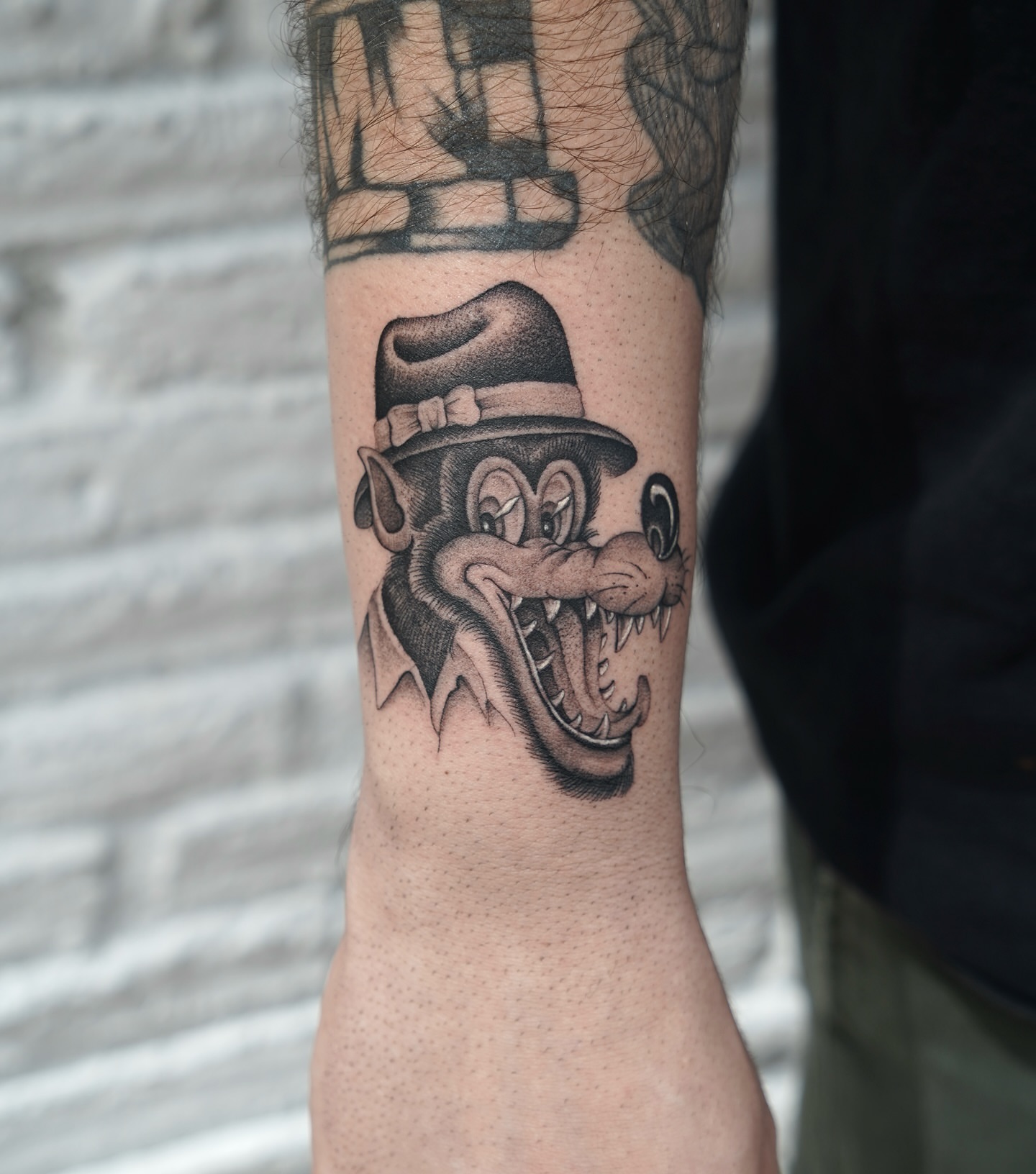 Monkey wearing hat black and grey tattoo on the forearm by Chriscalibur