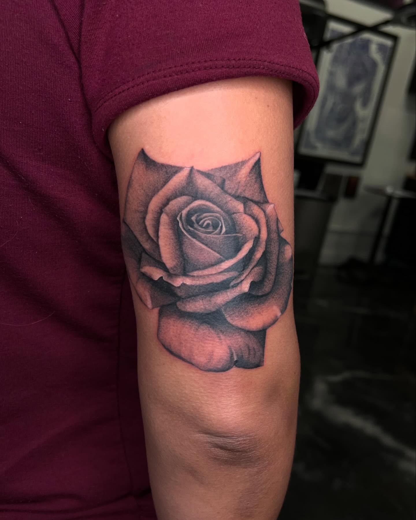 Rose black and grey tattoo on the forearm by San Diego Fineline Black & Grey Tattoo Artist