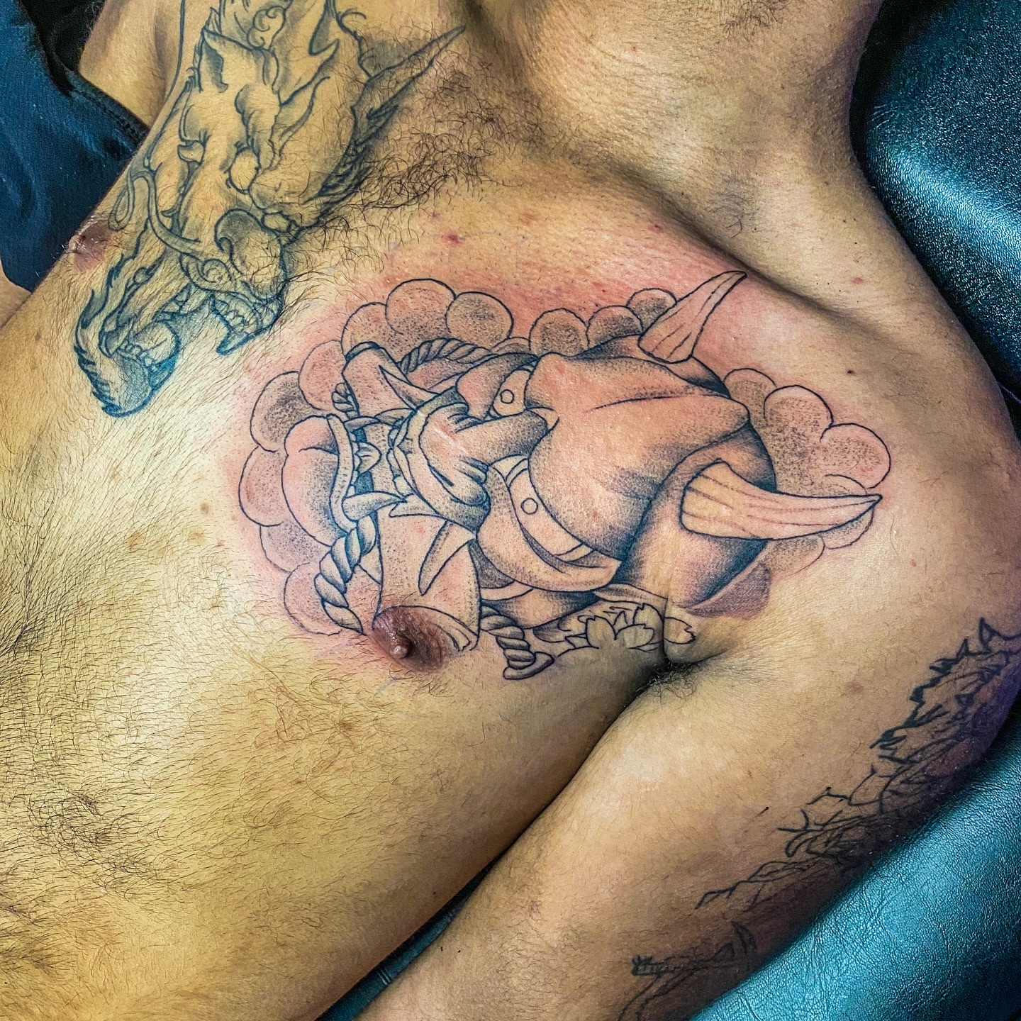 Pirate black and grey tattoo on the chest by Rico Rosario