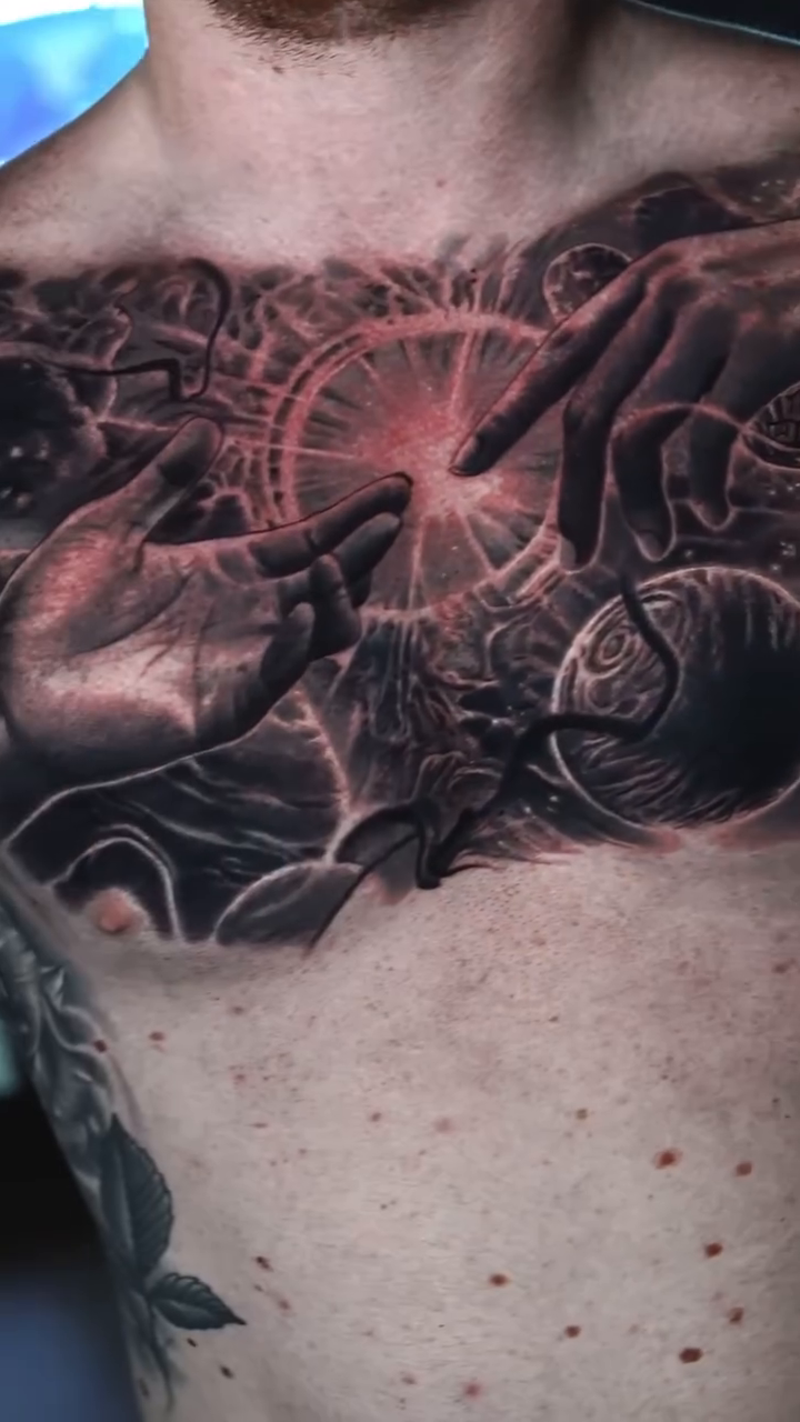 Cosmic scene with hands realism tattoo by Ryan Gage Gonzalez
