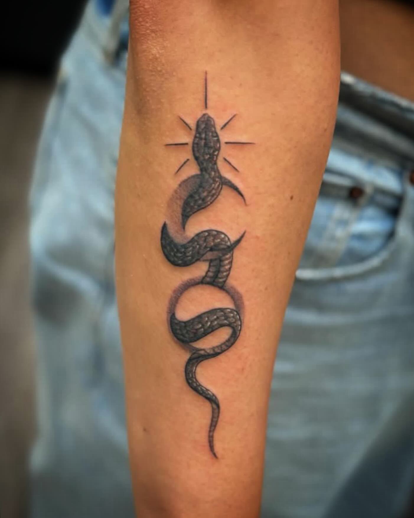 Snake black and grey tattoo on the forearm by MR
