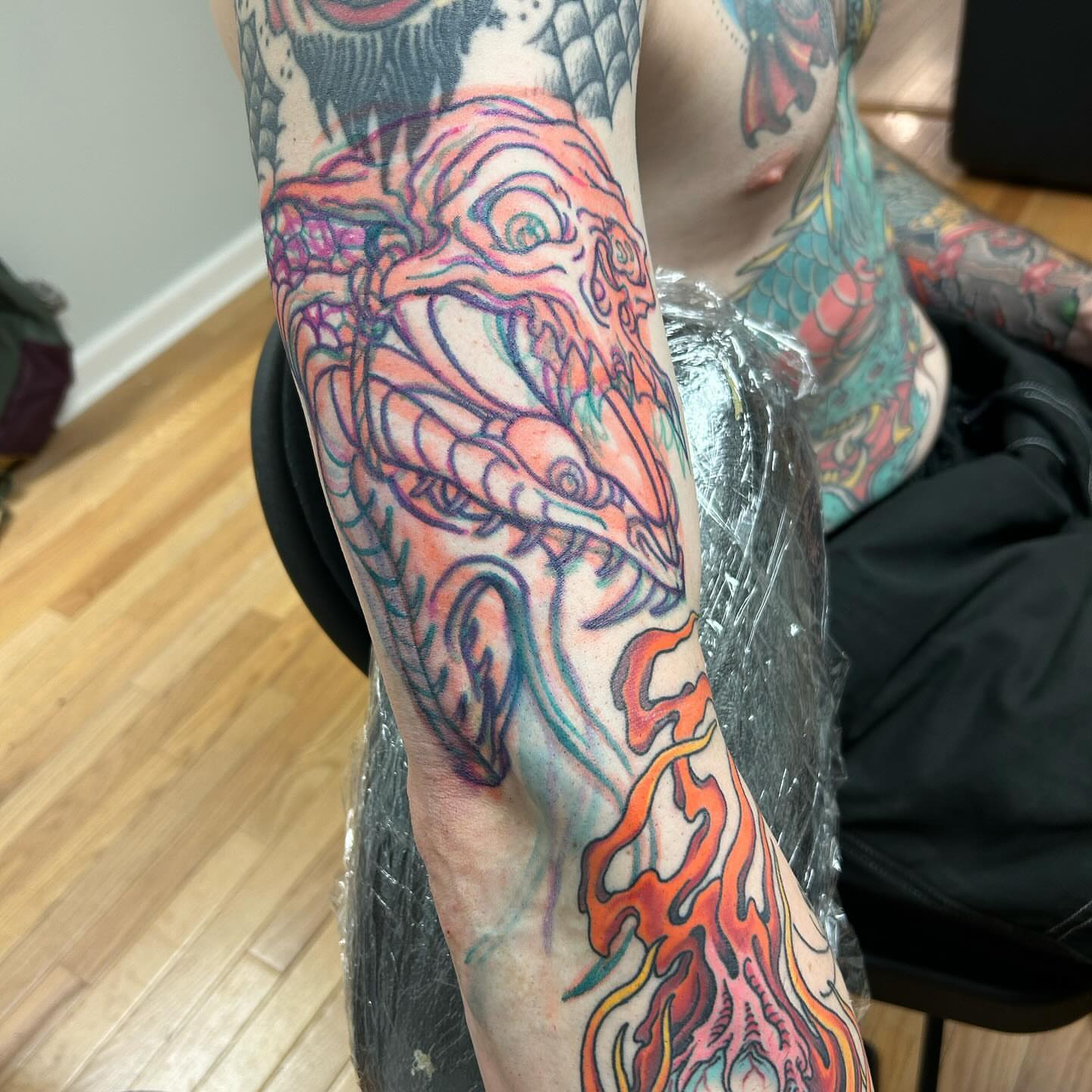Dragon new school tattoo on the forearm by Craig Gardyan
