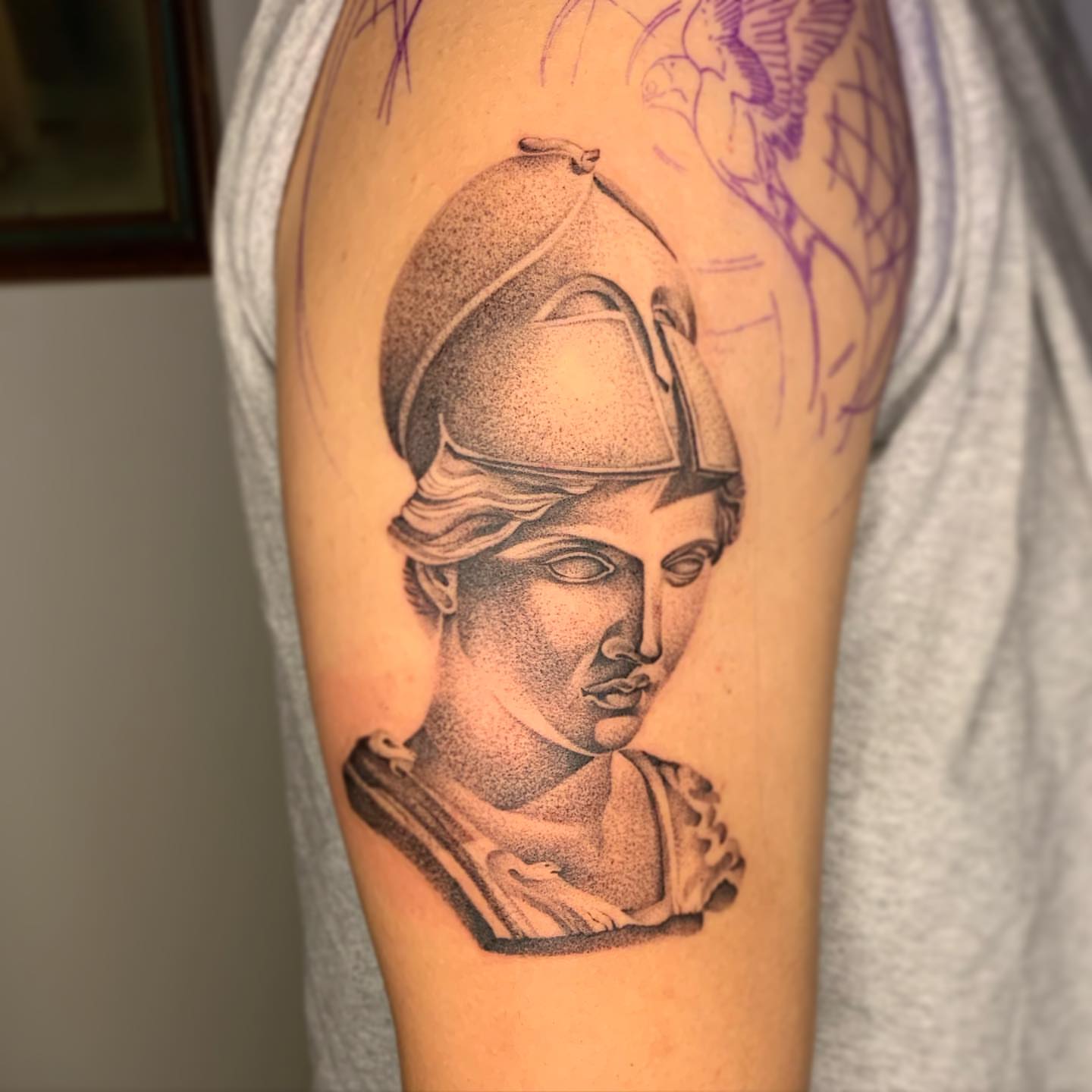 Statue bust dotwork tattoo on the upper arm by Jacob Deirfield, Circleville, Ohio