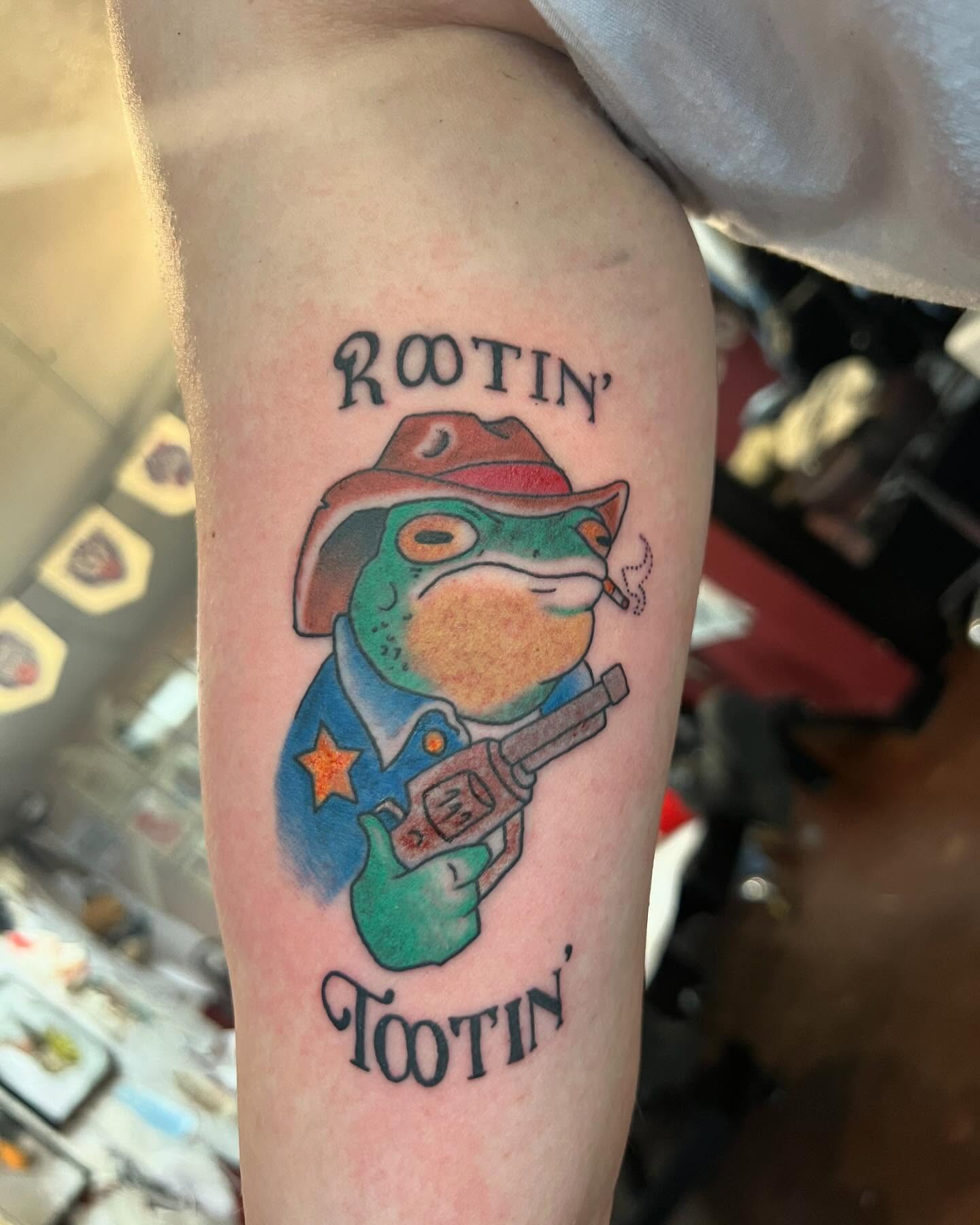 Frog cowboy American traditional tattoo on the forearm by Cody Marl