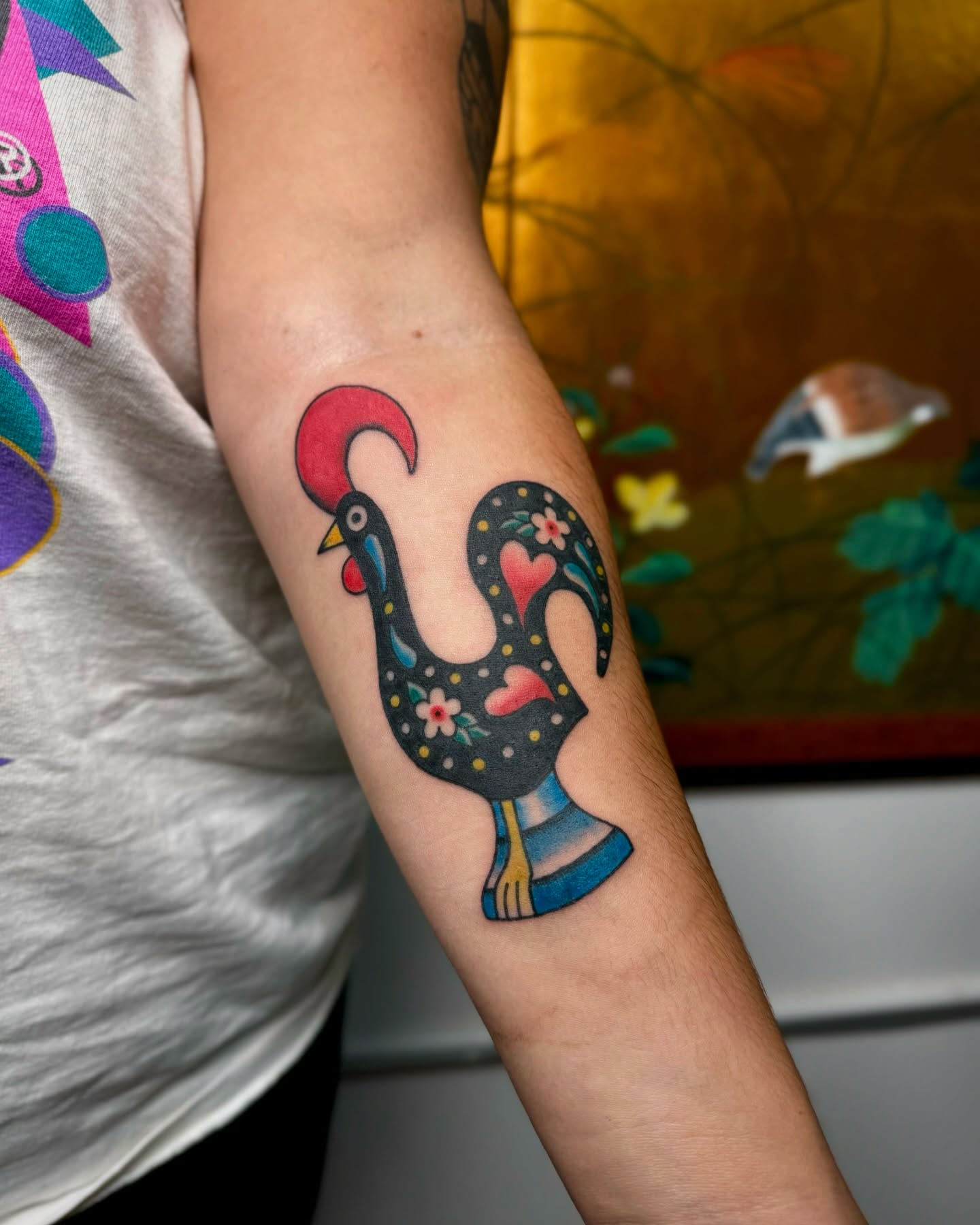 Rooster new school tattoo on the forearm by Mazie