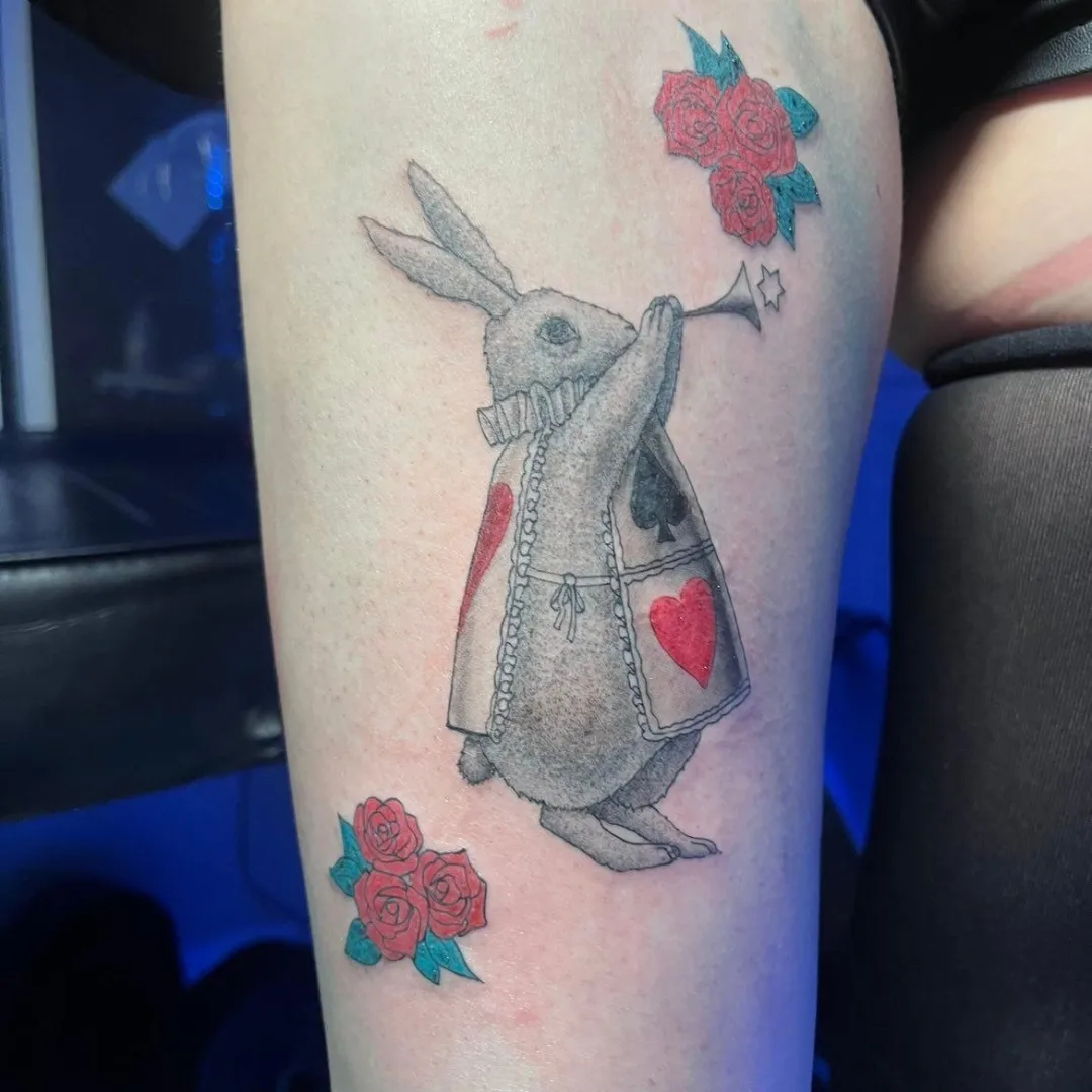 Rabbit playing trumpet black and grey tattoo on the forearm by Joc
