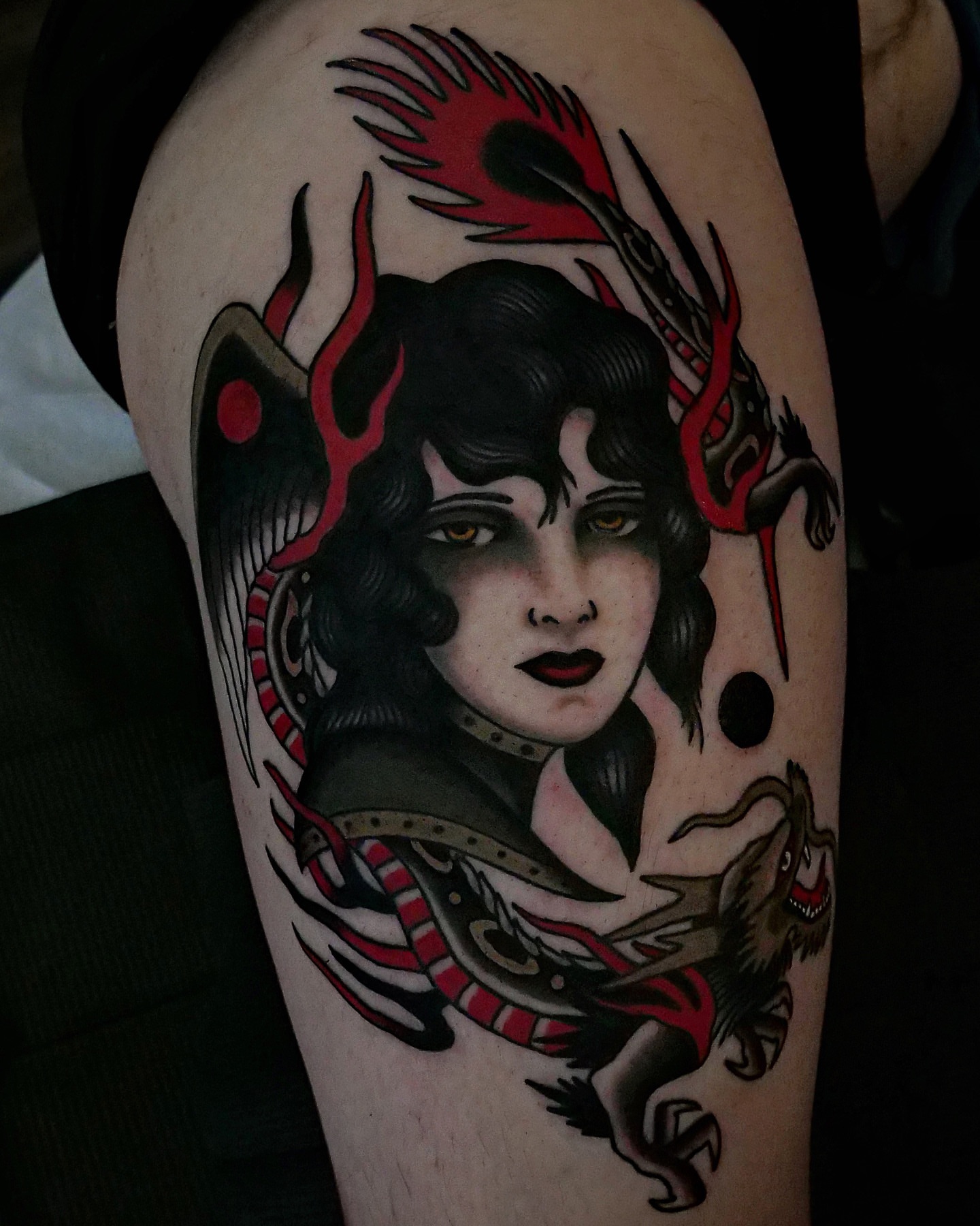 Woman with dragon American traditional tattoo on the forearm by Brandon Murphy