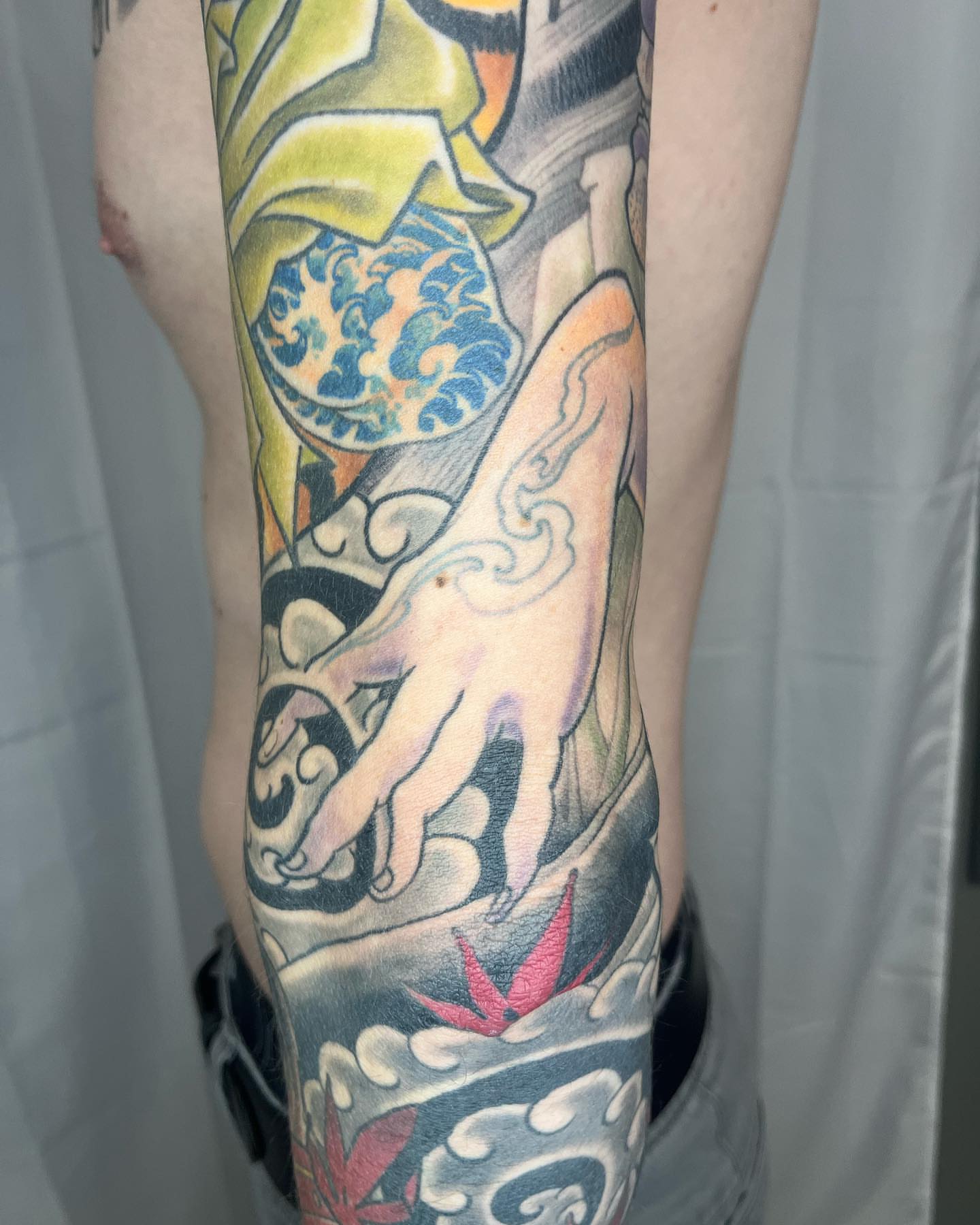 Abstract hand and floral japanese irezumi tattoo on the forearm by biggstattoos