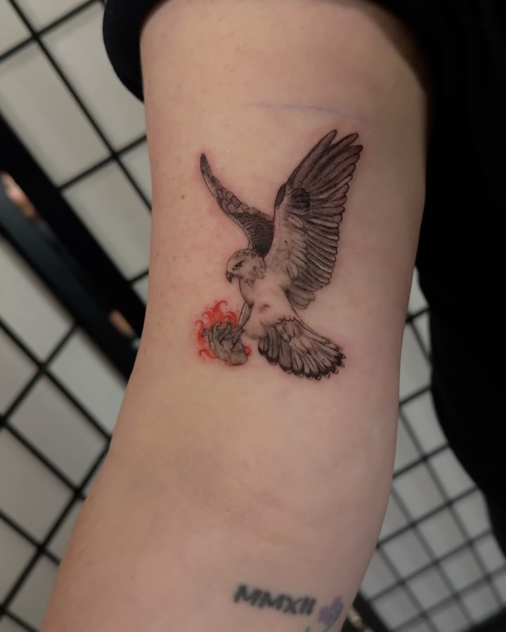 Falcon with flame realism tattoo on the forearm by jordyn ๐ญ