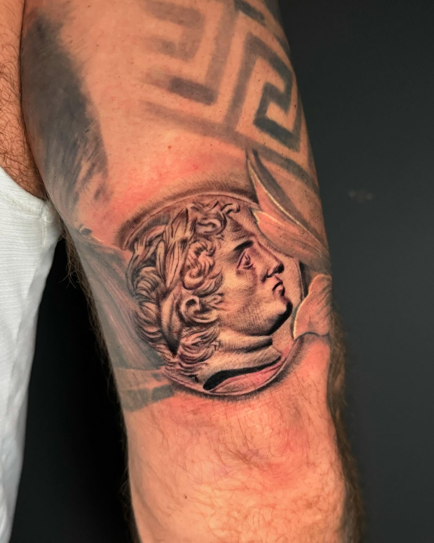 Statue head realism tattoo on the forearm by Zacharee Osborn