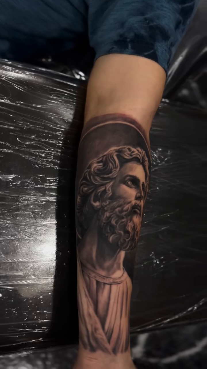 Tattoo by @tattoo_ravay — realism, black_and_grey
