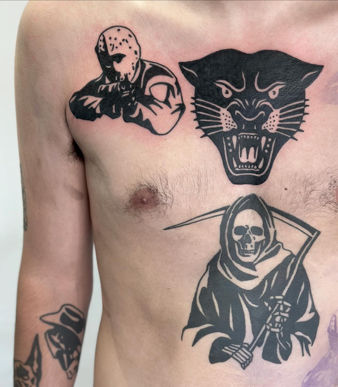 Horror characters black and grey tattoo on the chest by Han shinko, Portland, Oregon