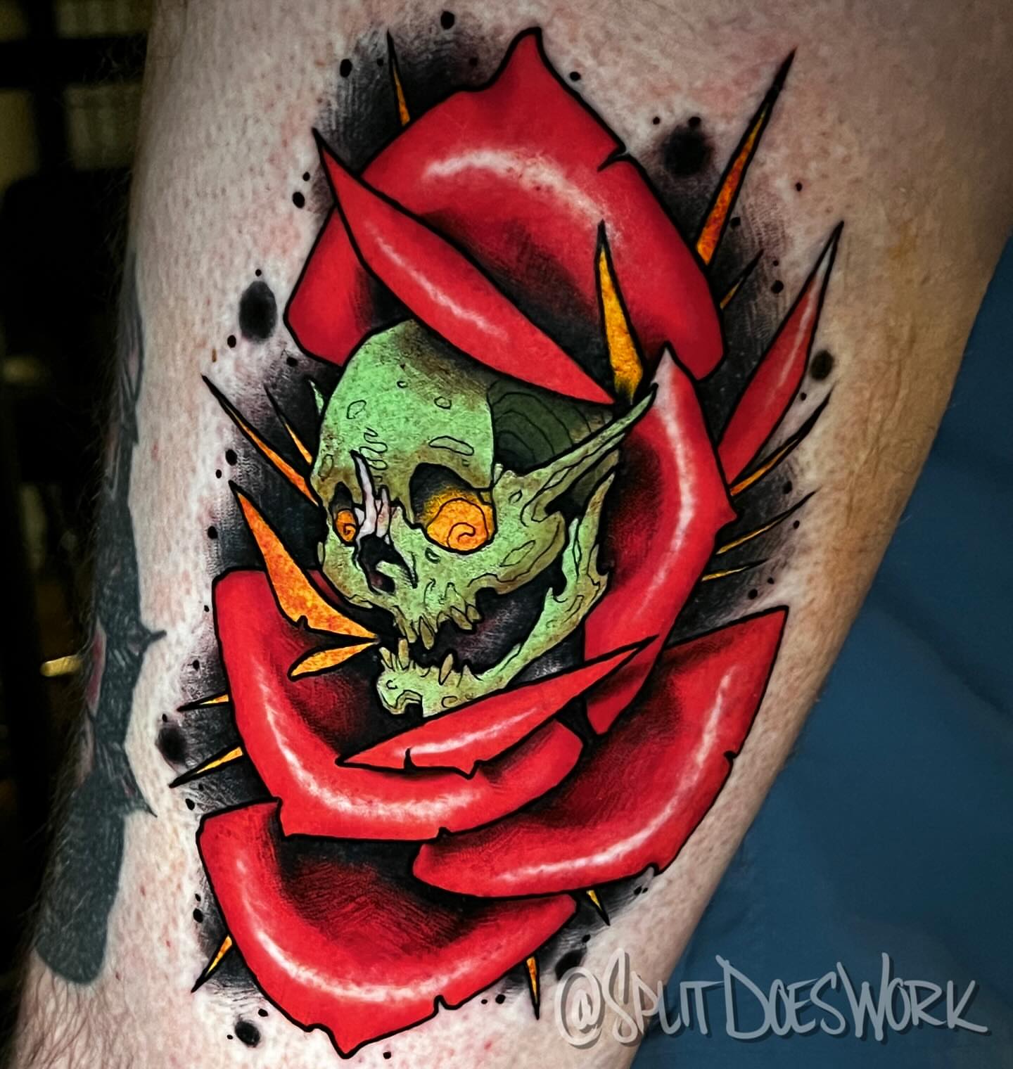 Skull and rose American traditional tattoo on the forearm by Geoff “Split” DiVittorio