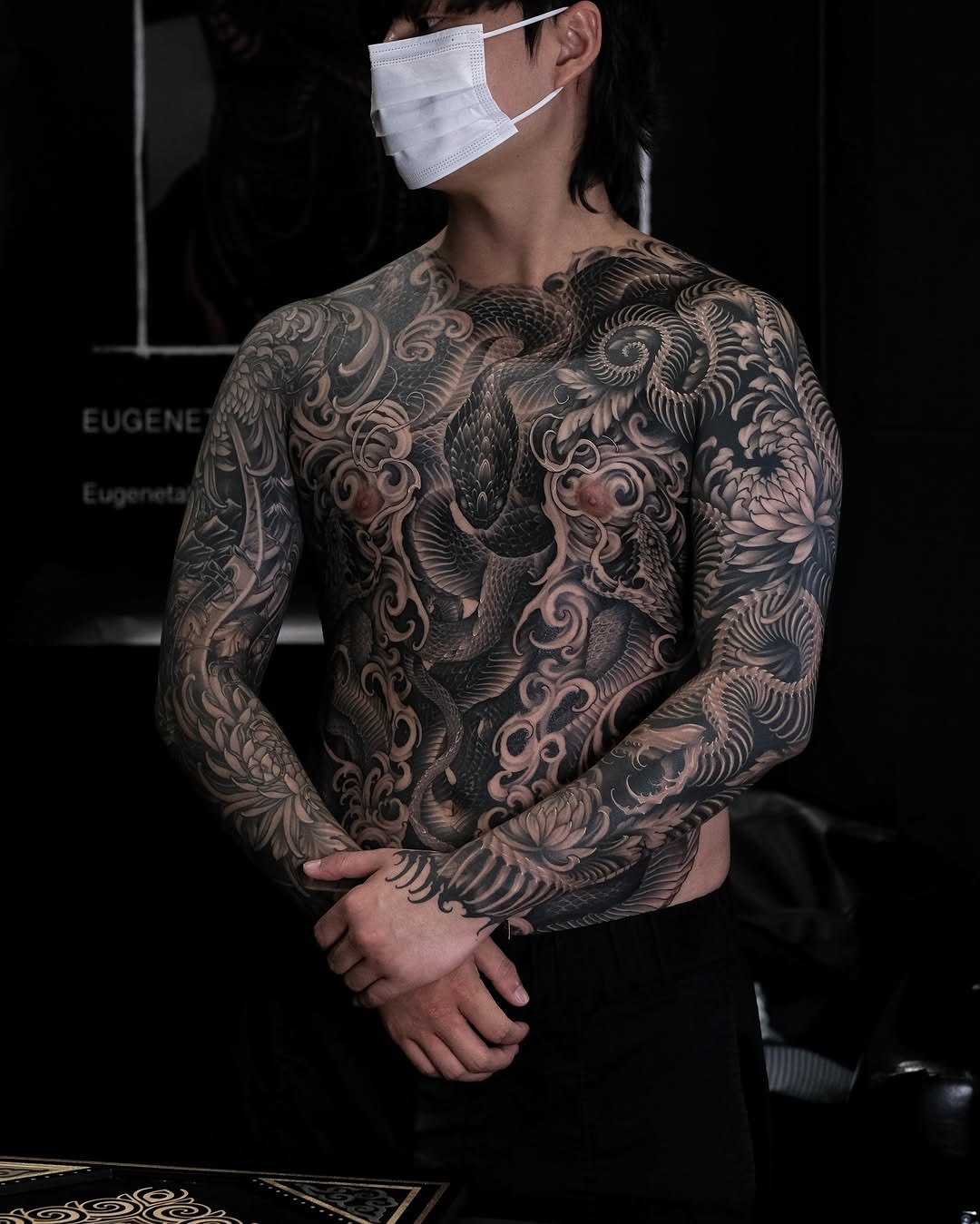Dragon and chrysanthemum Japanese tattoo on the torso by Yujin Ju