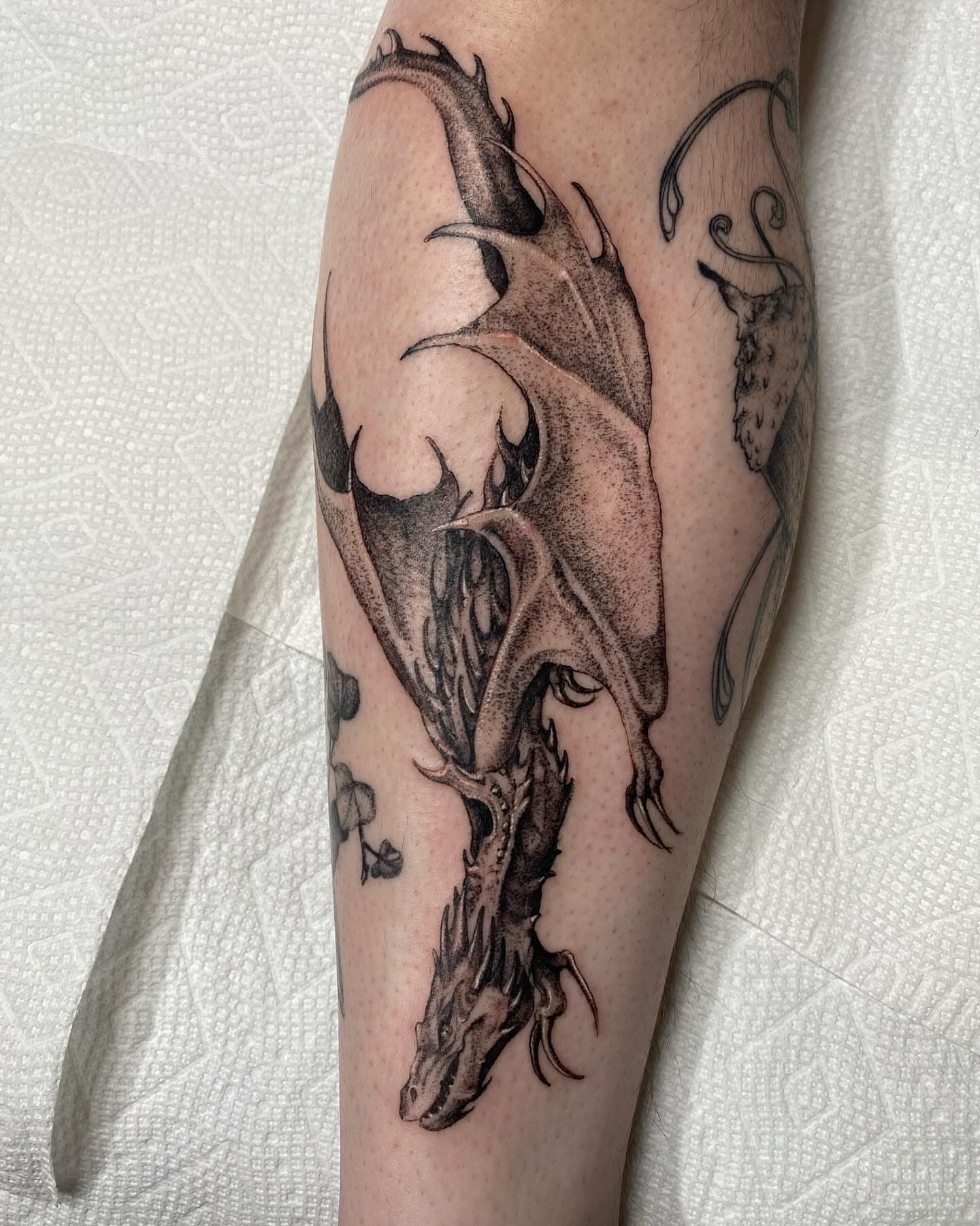 Dragon dotwork tattoo on the forearm by Amber Miracle