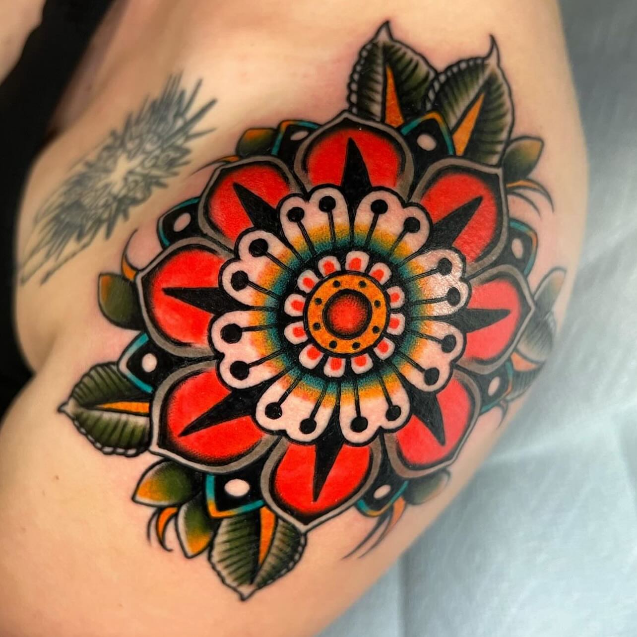 Floral mandala American traditional tattoo on the shoulder by Hailey Johnson
