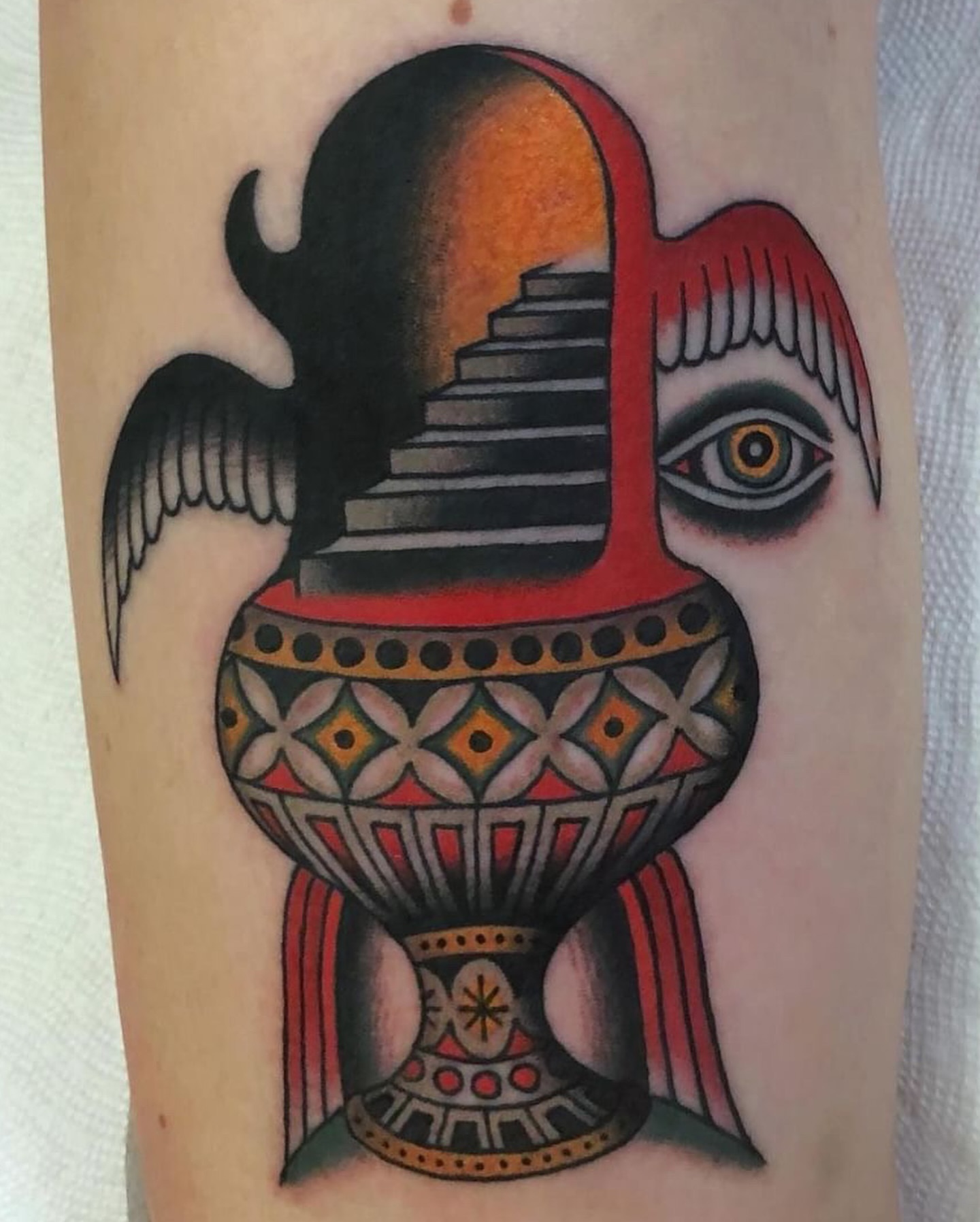 Urn with staircase and eye American traditional tattoo on the forearm by Ben Fiedler