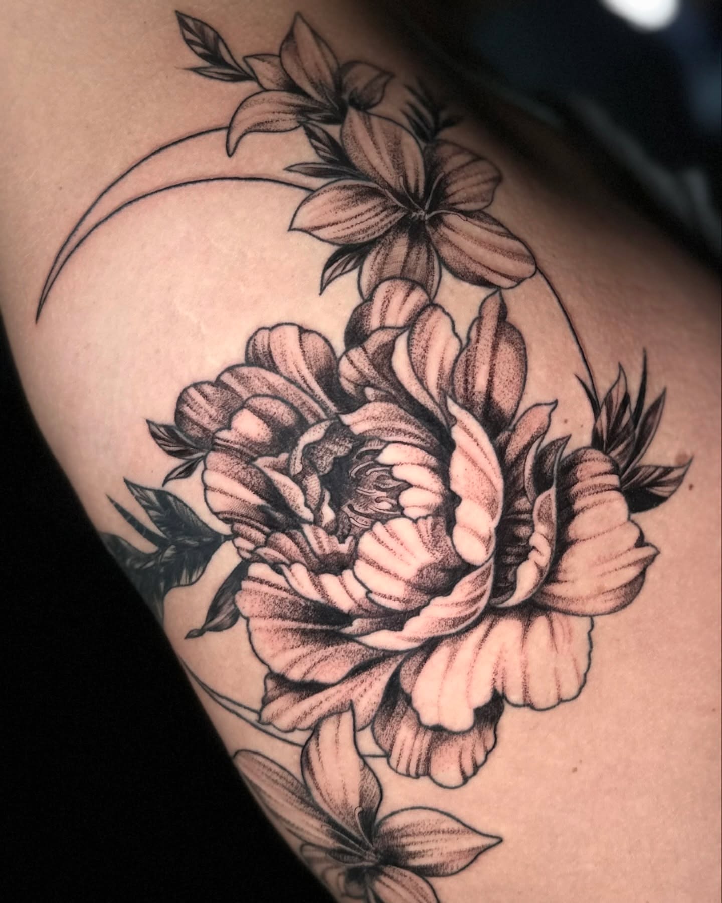 Peony black and grey tattoo on the thigh by Aris