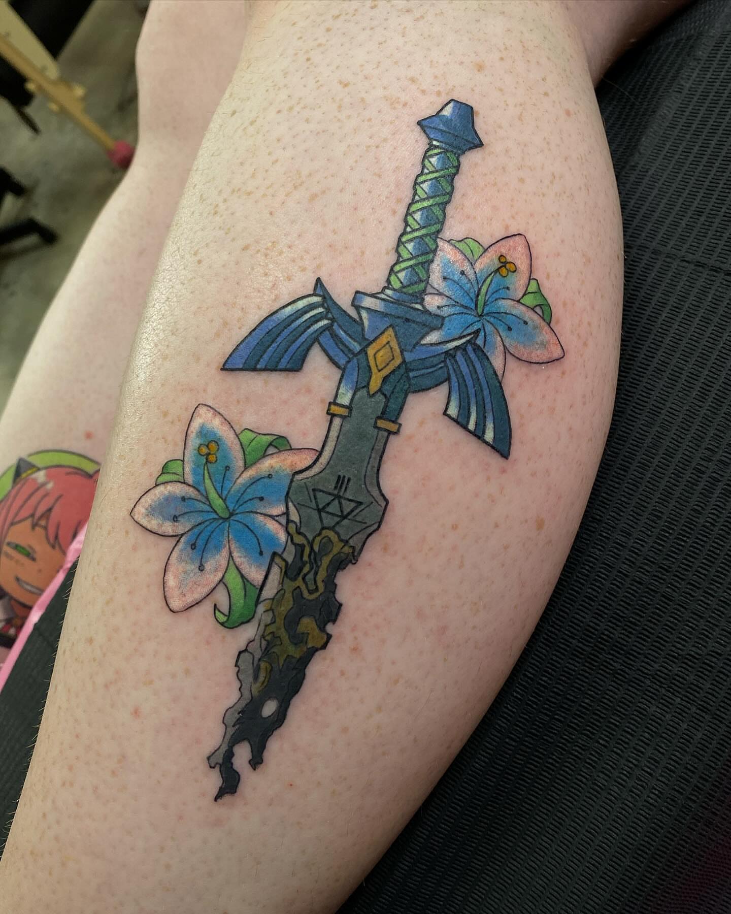 Sword and flowers new school tattoo on the forearm by @kaitlin.tattoos, Richmond, Virginia