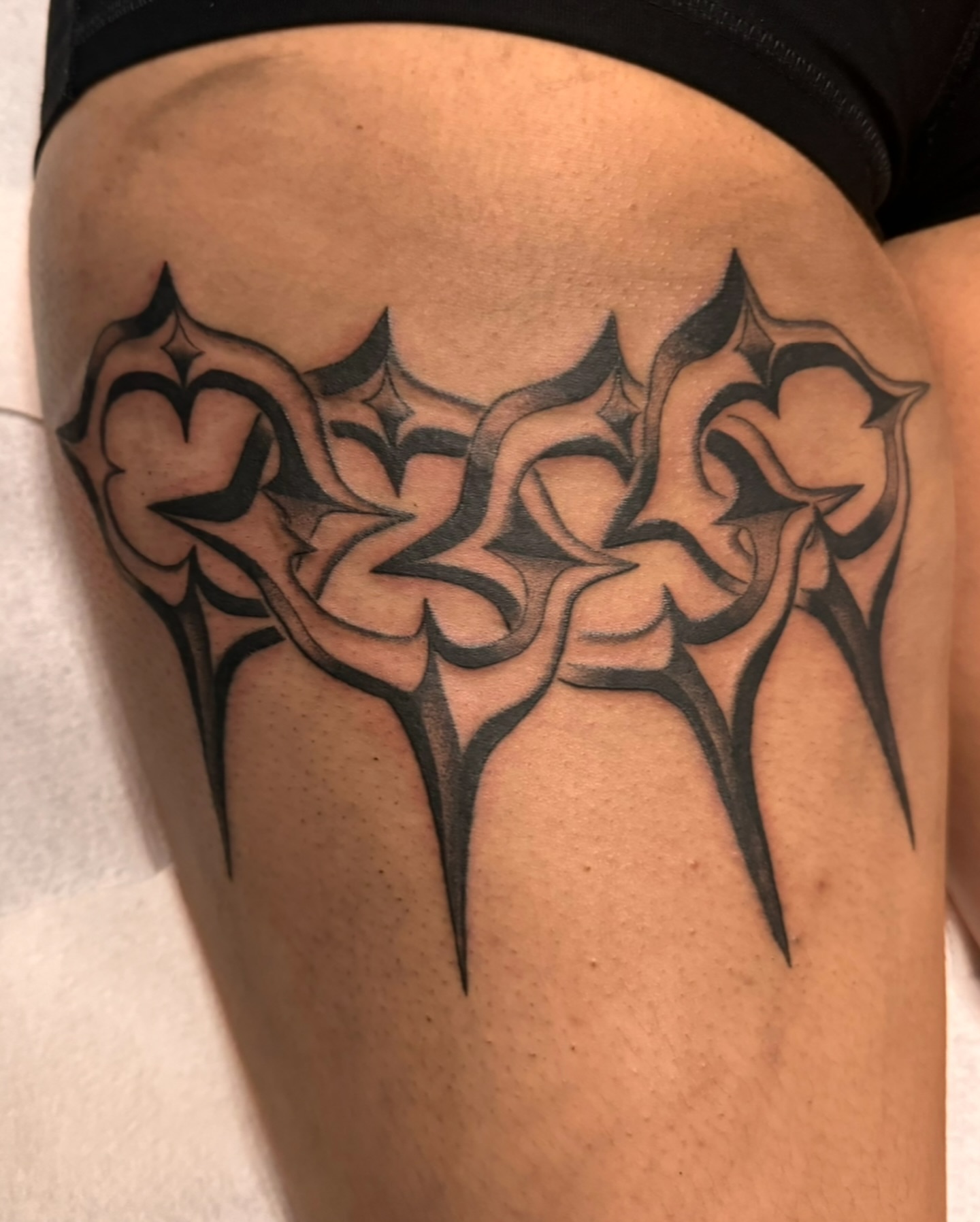 Tribal design tribal tattoo on the thigh by Mika