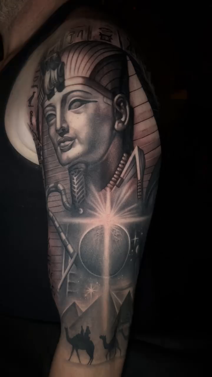 Pharaoh's head with desert scene realism tattoo by Ana Reyes