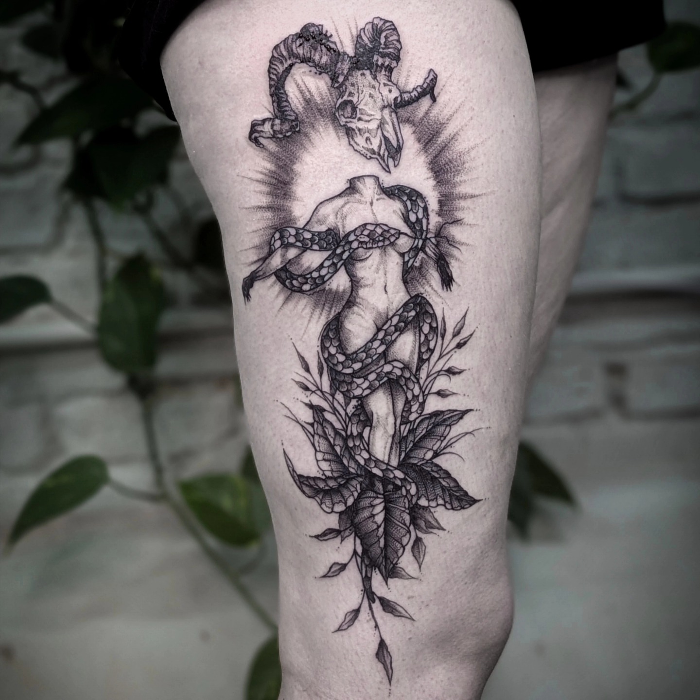 Snake and woman dotwork tattoo on the thigh by Gail Howard Perry III