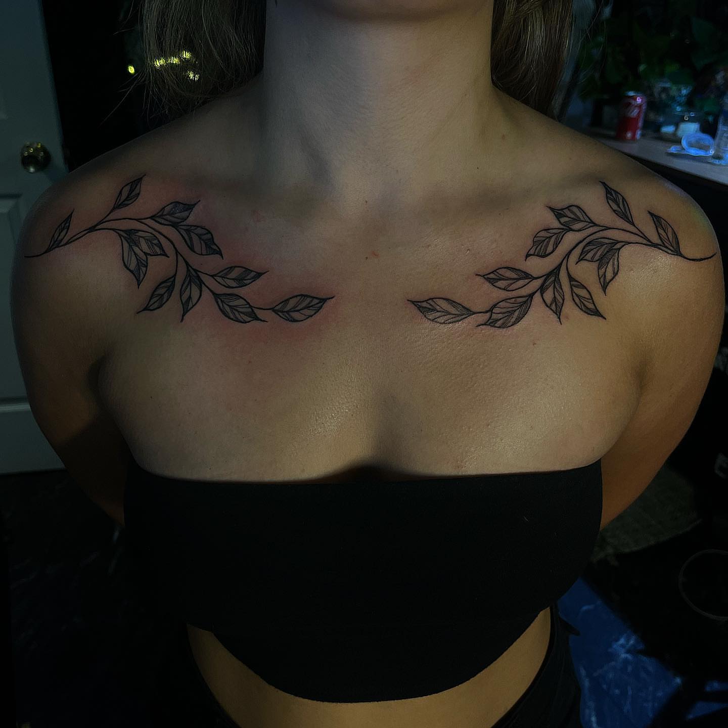Branch with leaves black and grey tattoo on the chest by π΅πππππ