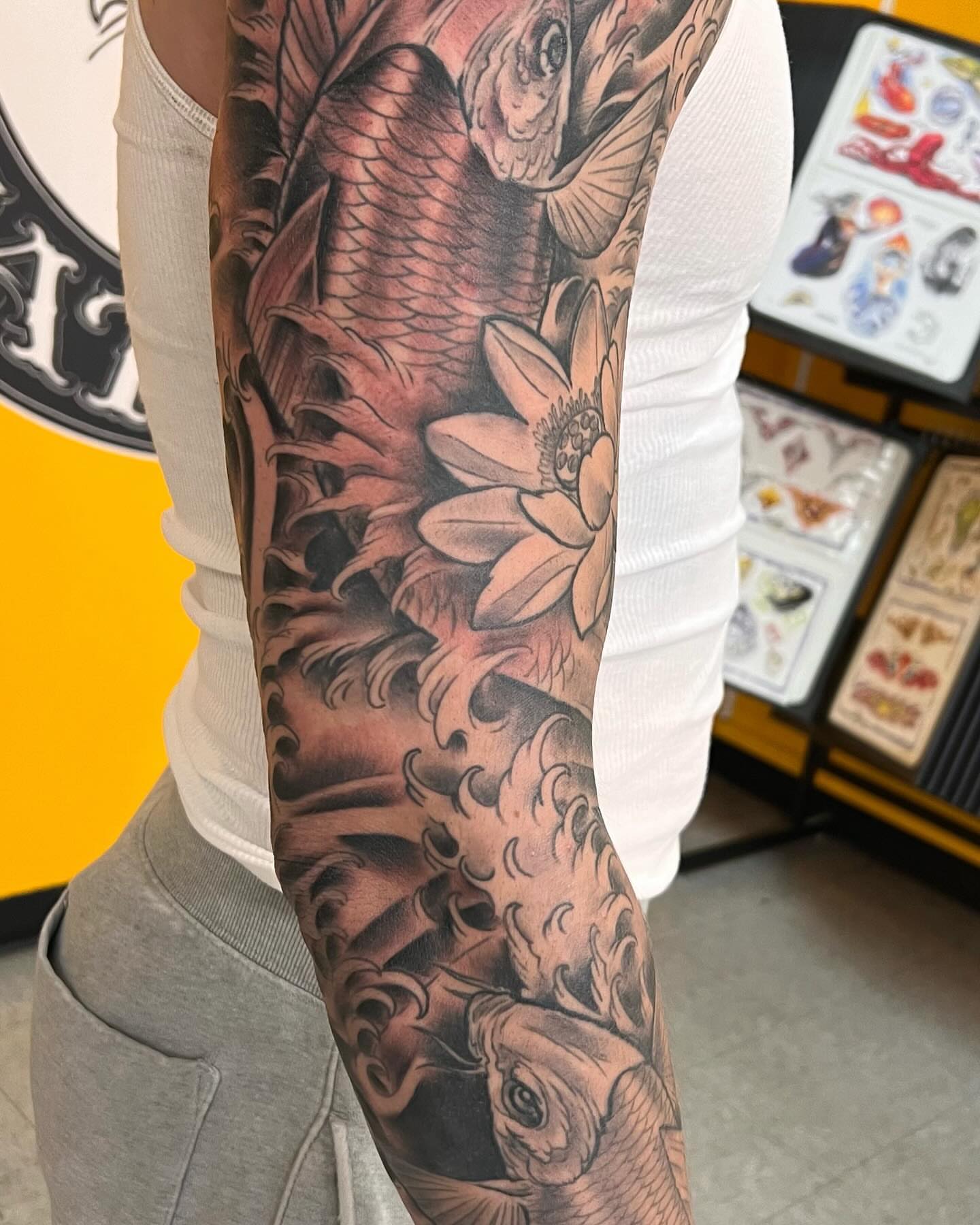 Koi fish and lotus flower japanese irezumi tattoo on the forearm by Frank Gomez 🎨